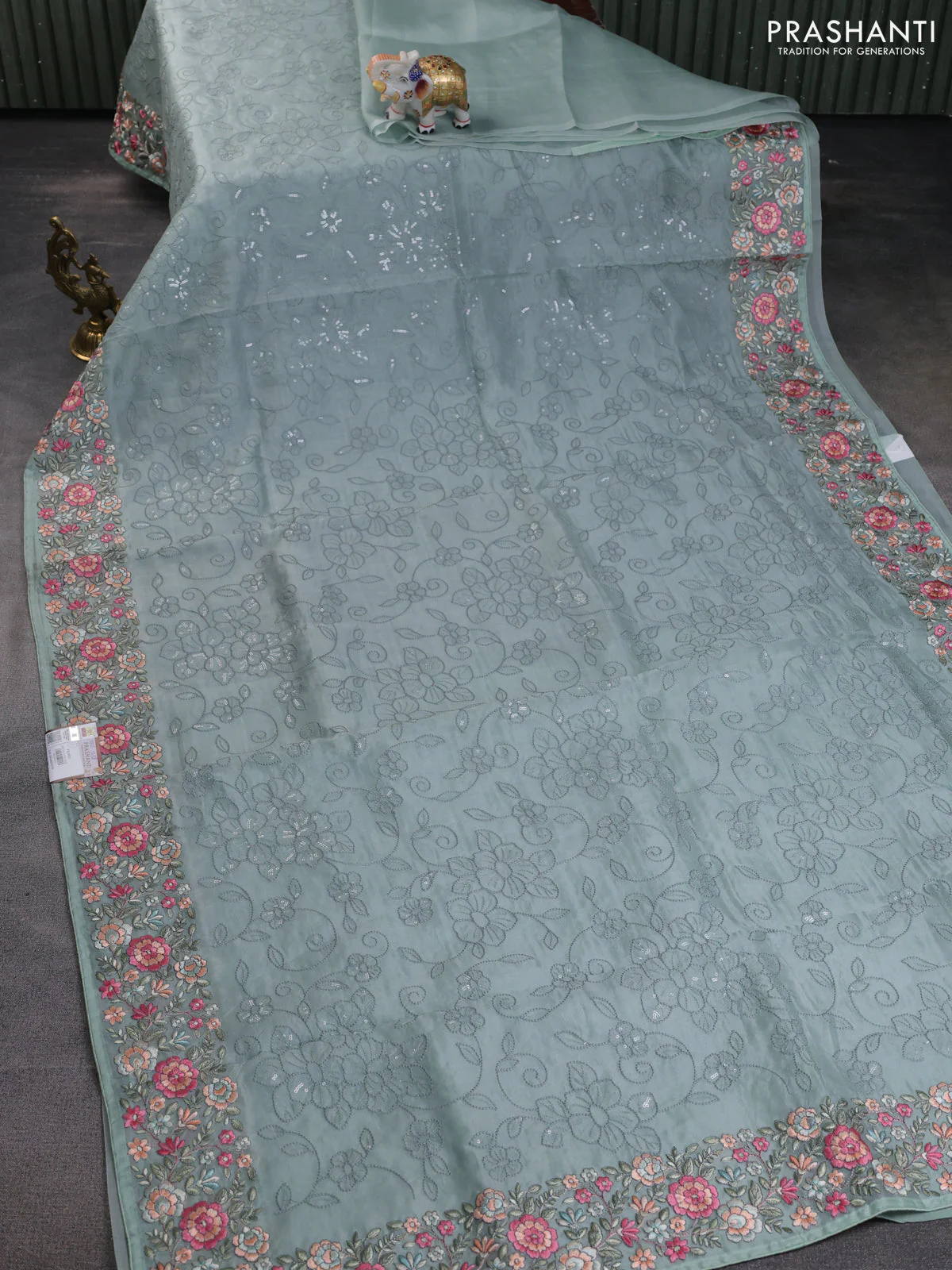 Pure organza silk saree pastel blue shade with allover embroidery and floral embroidery border - Image 2