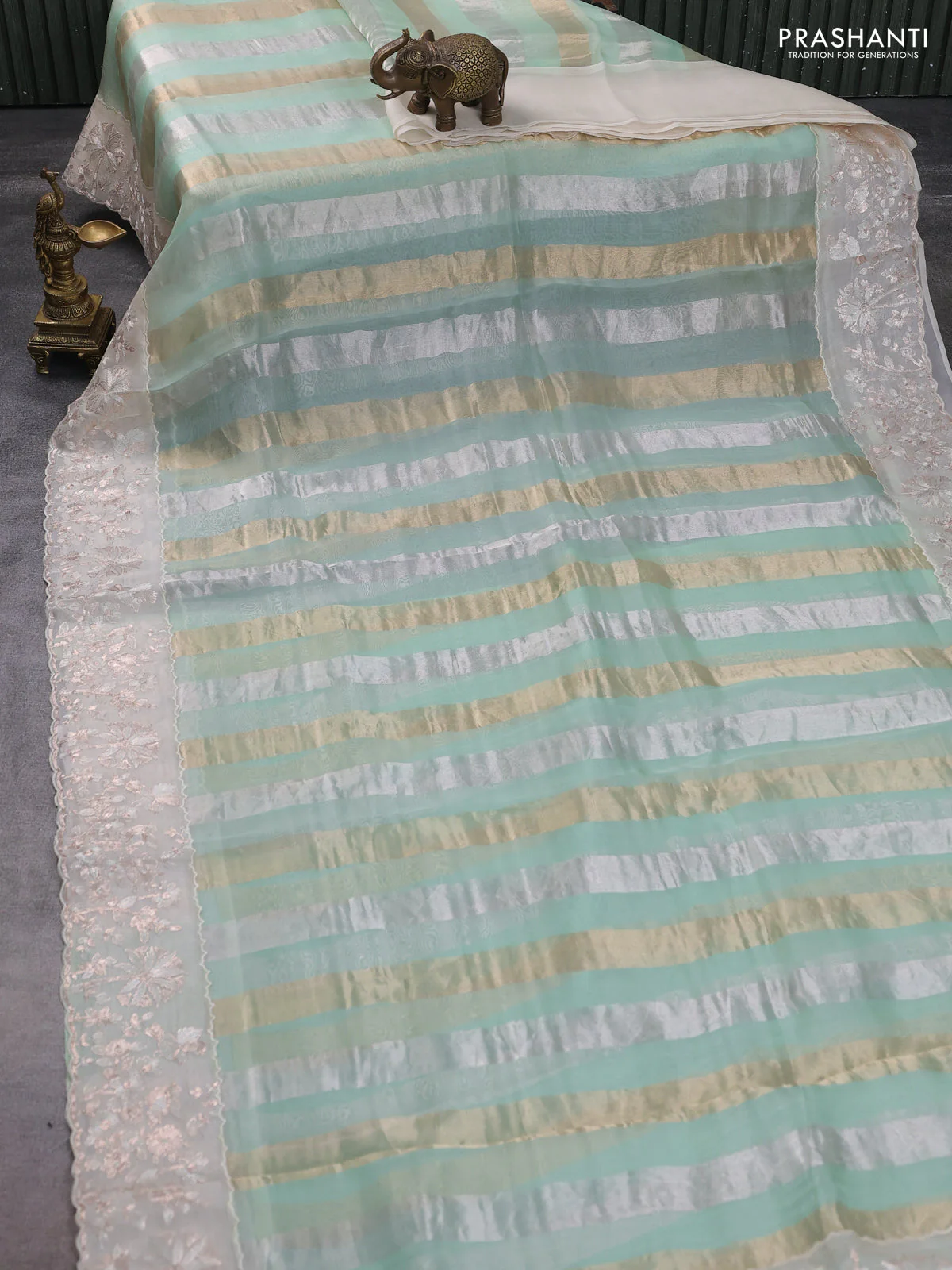 Pure organza silk saree pastel green and cream with allover silver & gold stripes pattern and embroidery border - Image 2