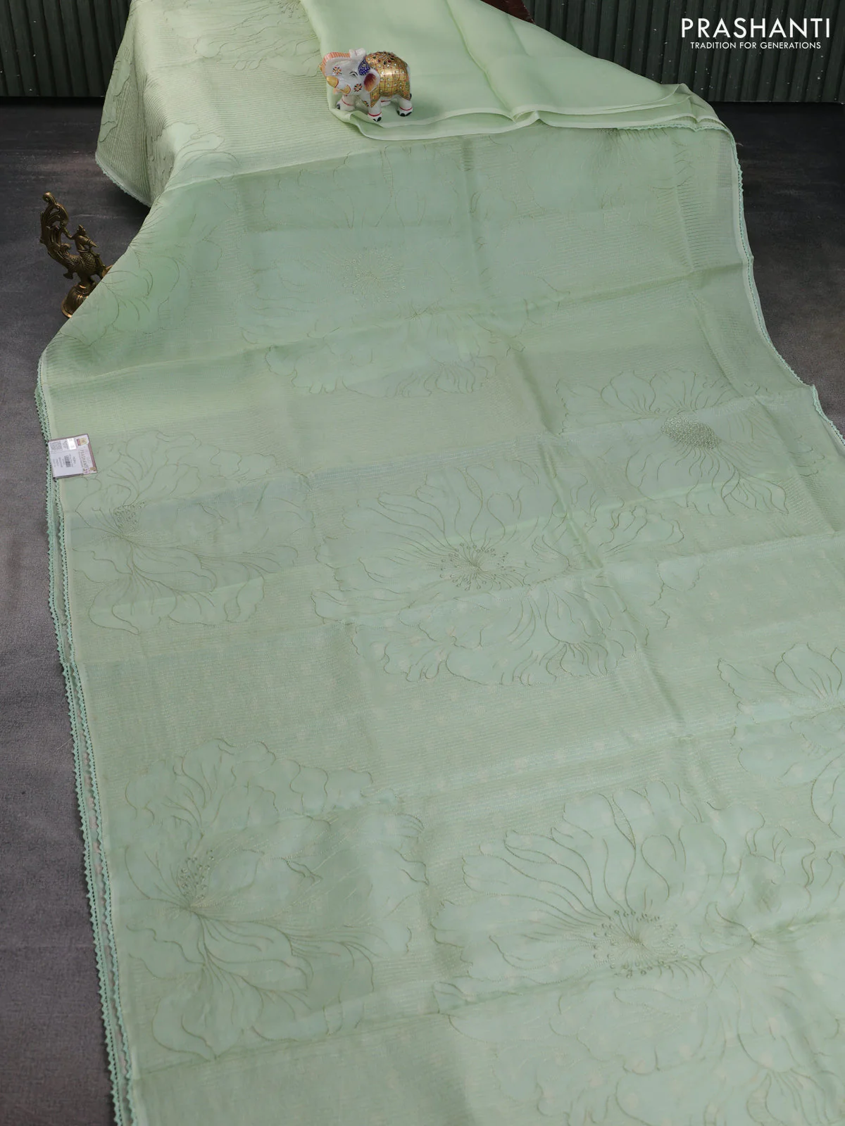 Pure organza silk saree pastel green with allover embroidery and lace work border - Image 2