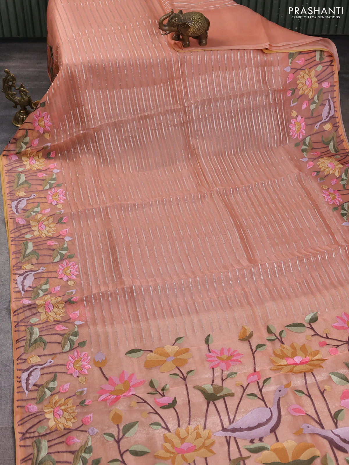 Pure organza silk saree peach shade and pale yellow with allover silver zari weaves and floral embroidery border - Image 2
