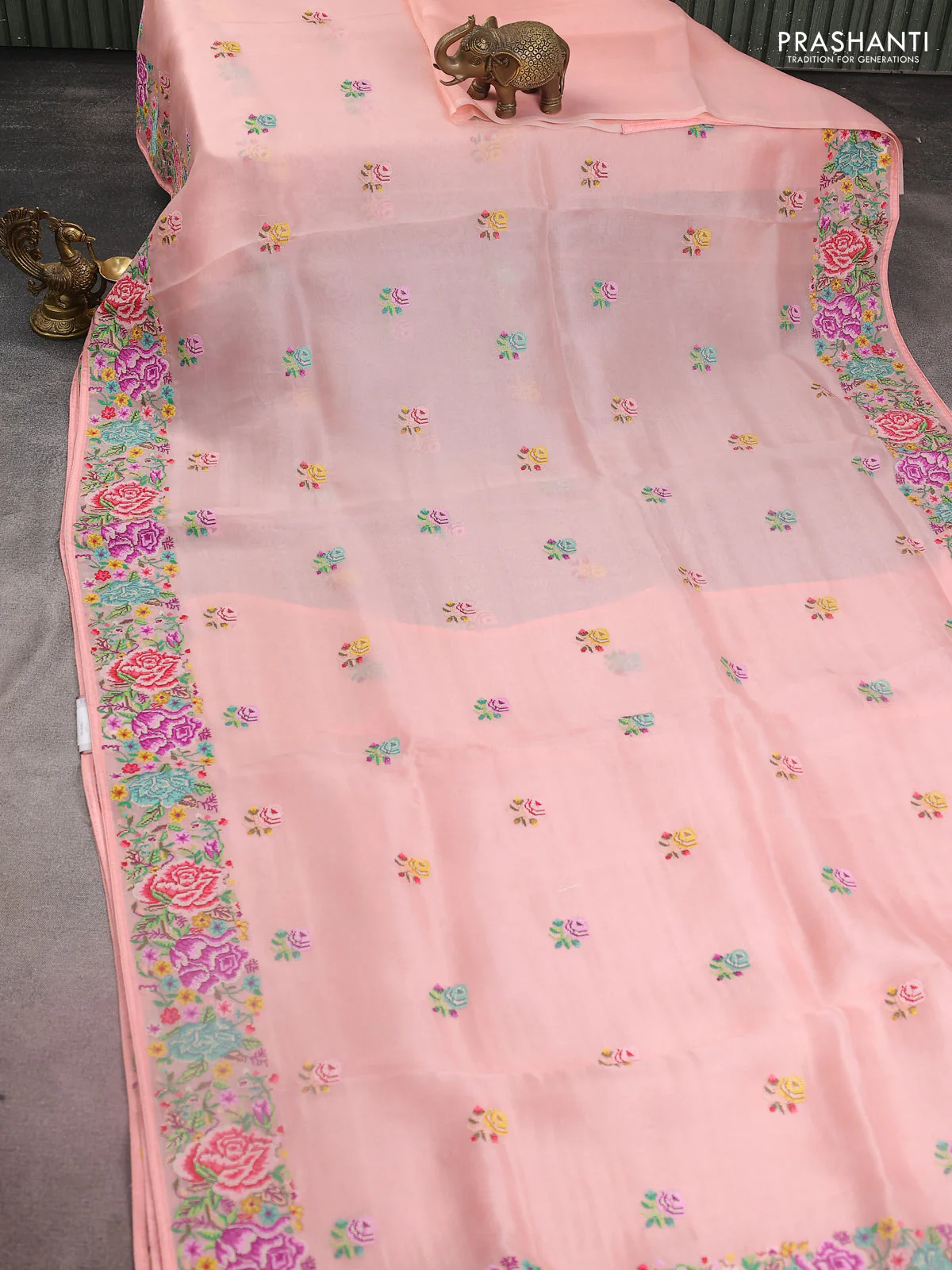 Pure organza silk saree peach shade with embroidery work buttas and floral design embroidery border - Image 2