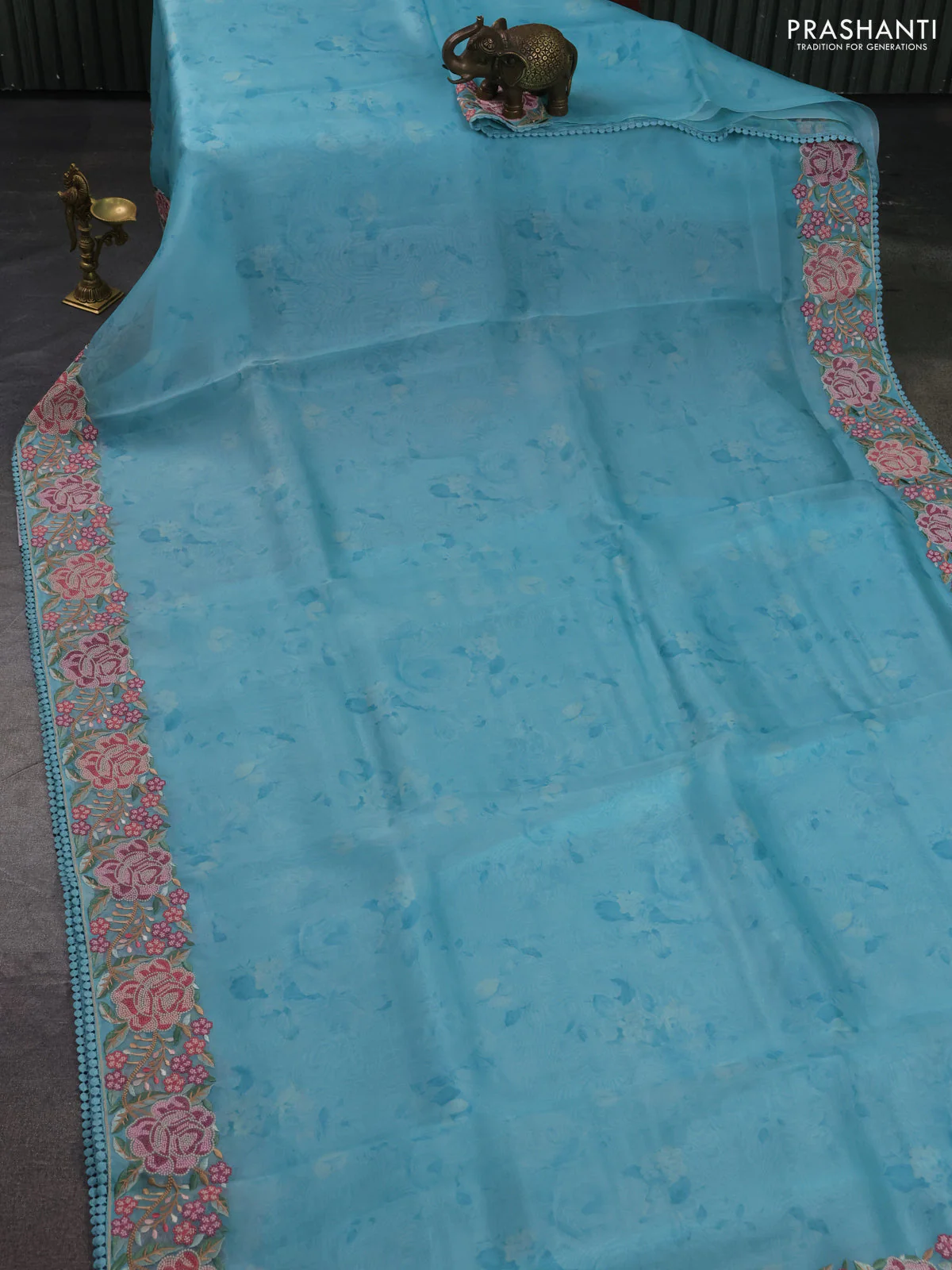 Pure organza silk saree teal blue with floral prints and floral embroidery border - Image 2
