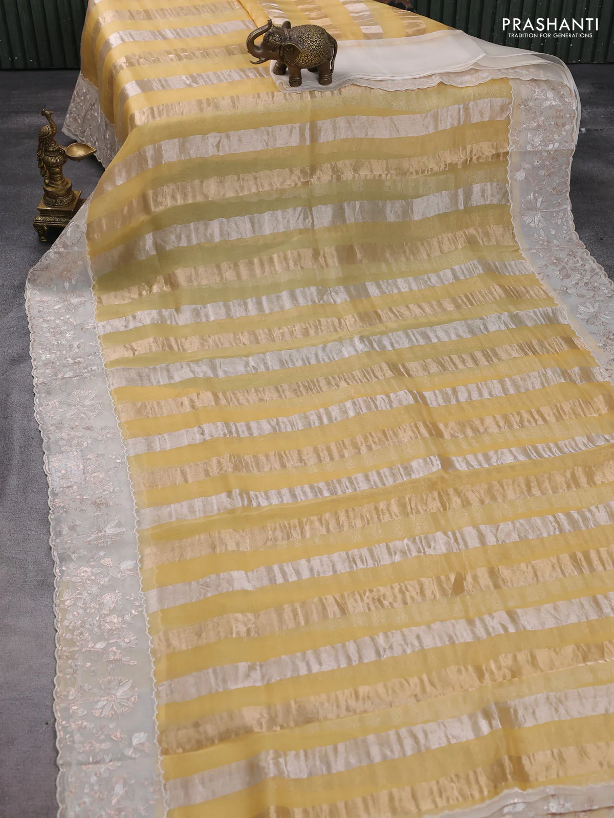 Pure organza silk saree yellow and cream with allover silver & gold stripes pattern and embroidery border - Image 2