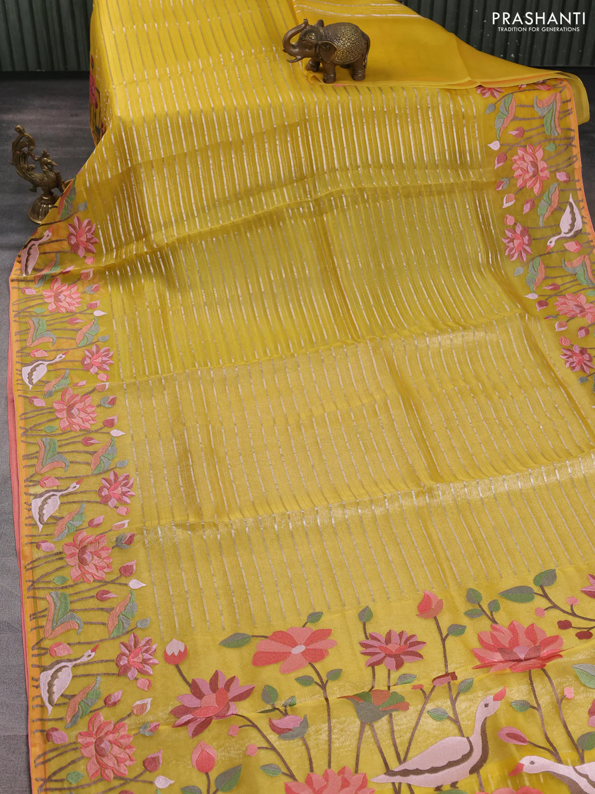 Pure organza silk saree yellow and peach shade with allover silver zari weaves and floral embroidery border - Image 2
