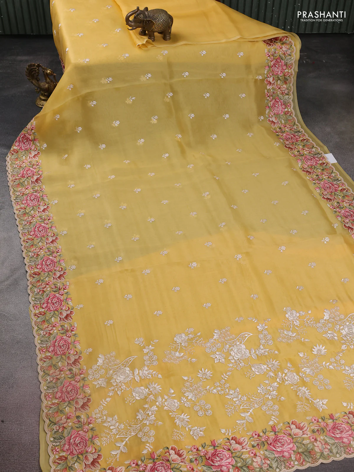 Pure organza silk saree yellow with embroidery work buttas and floral design embroidery border - Image 2