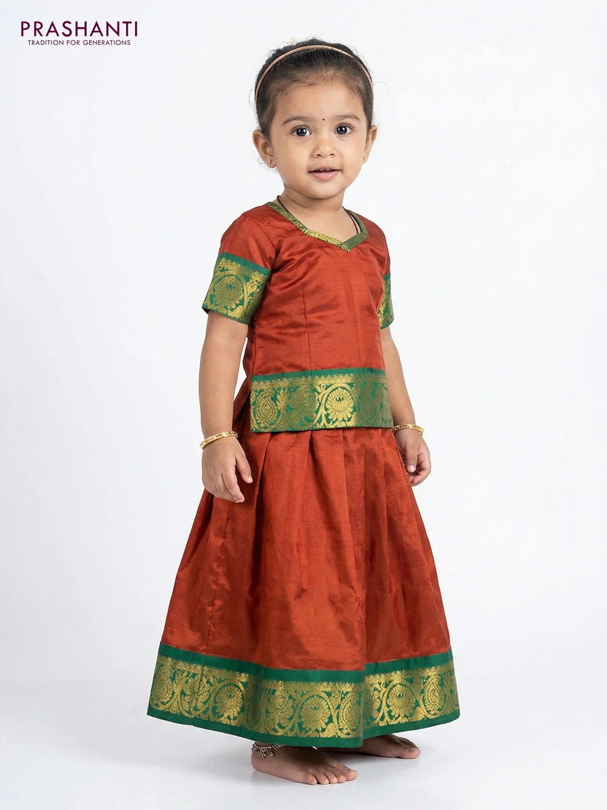 Pure silk unstitched kids lehenga rustic orange and green with plain body and zari woven border - Image 2