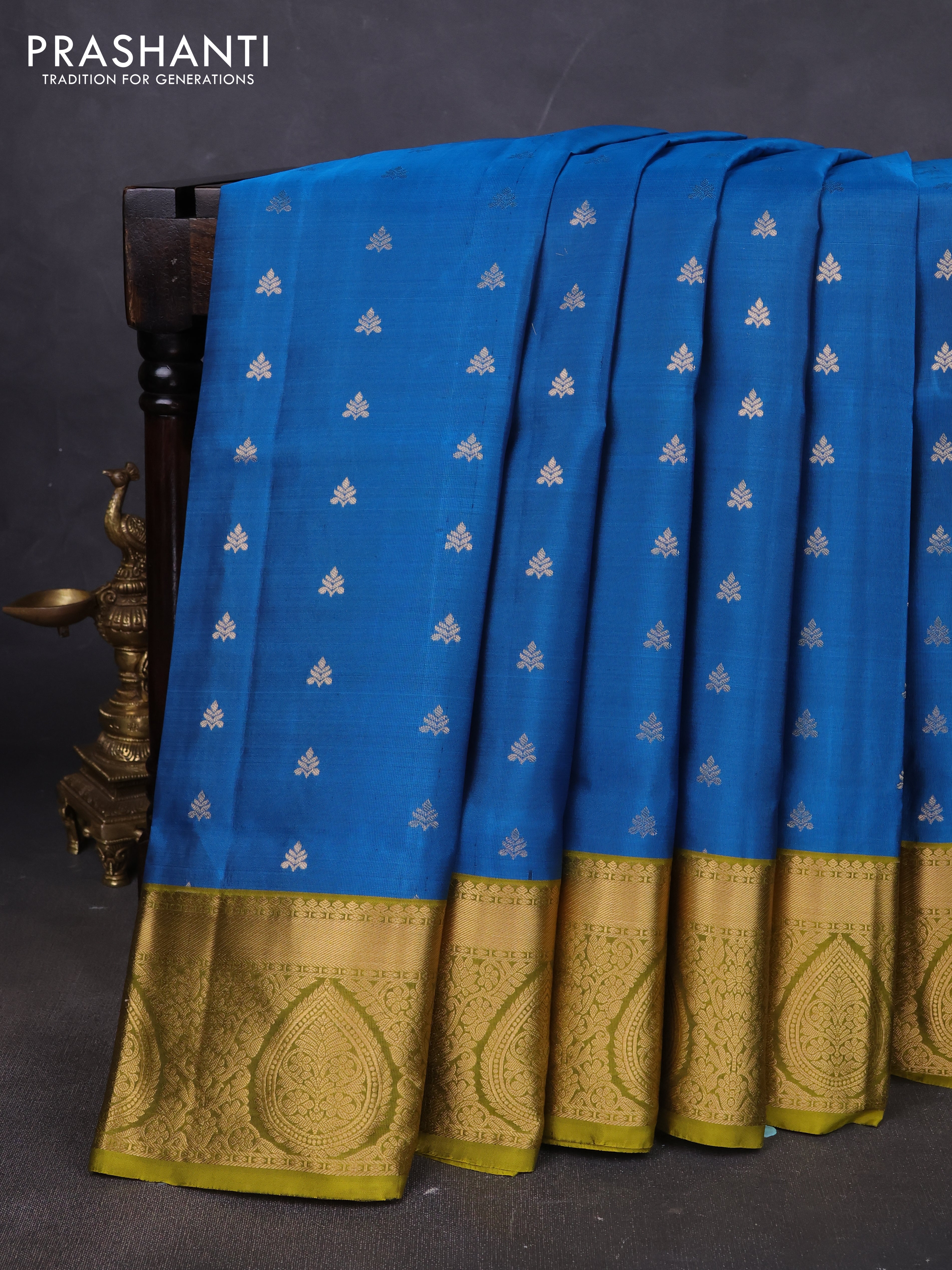 Pure soft silk saree cs blue and mehendi green with allover zari woven buttas and rich zari woven border