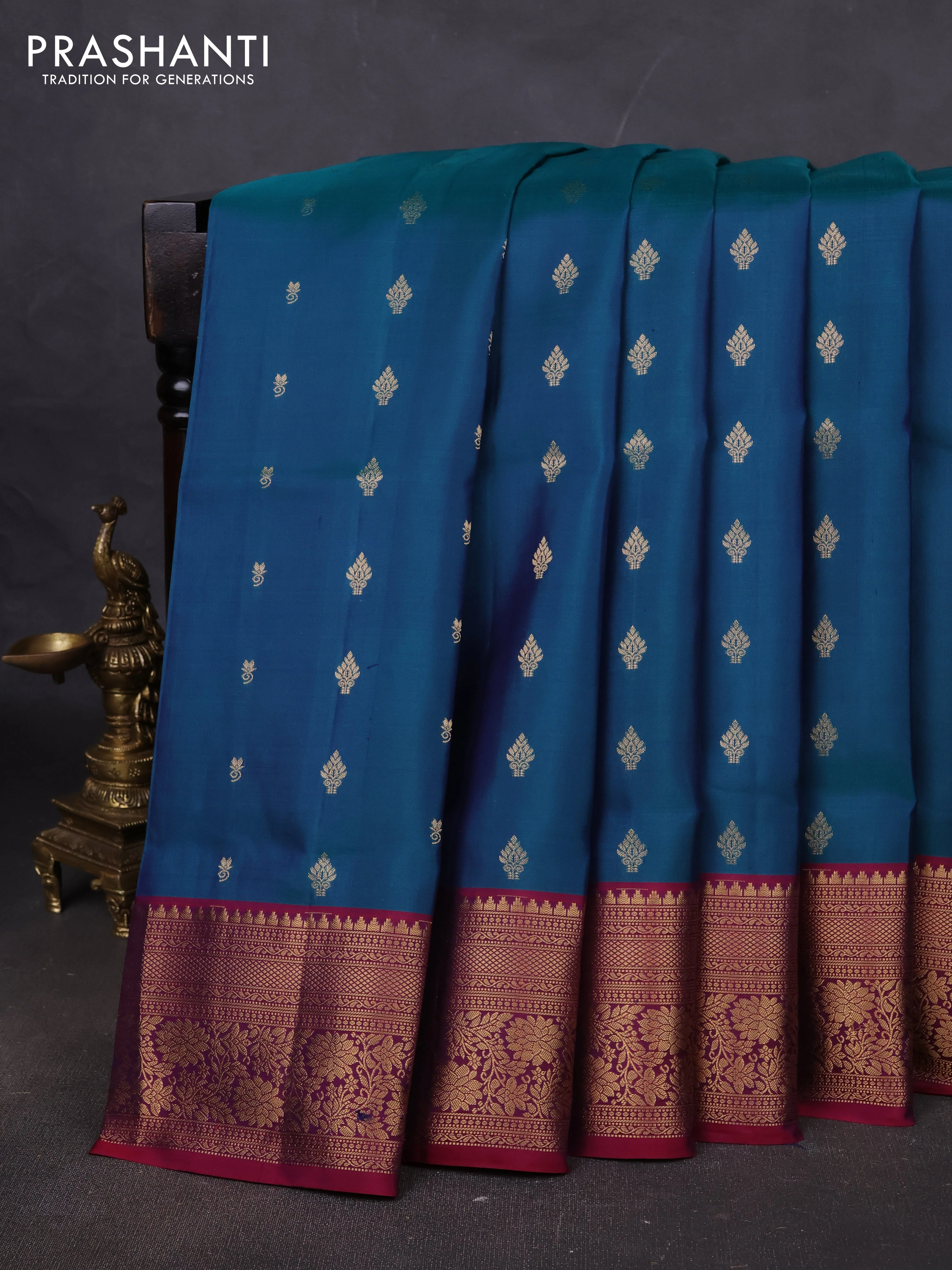 Pure soft silk saree dual shade of peacock green and dark magenta pink with allover zari woven buttas and zari woven floral border