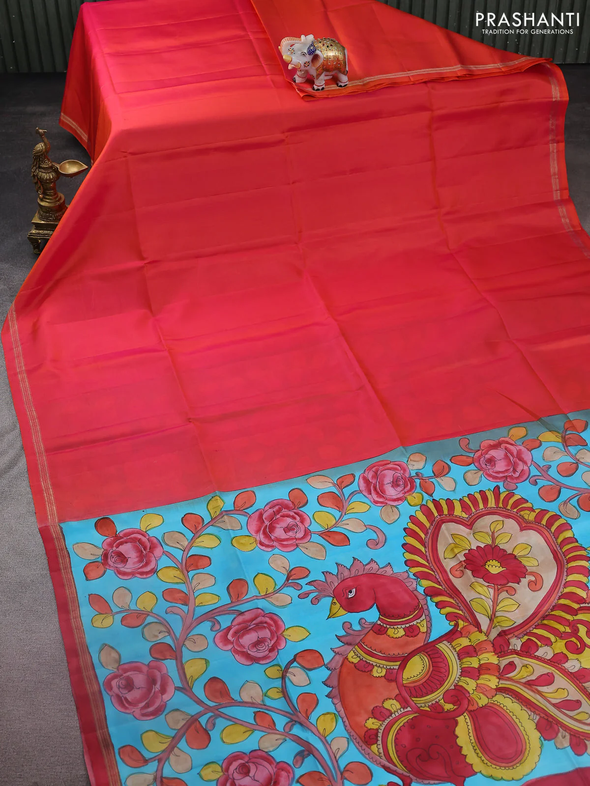 Pure soft silk saree dual shade of pinkish orange and light blue with plain body and kalamkari hand painted pallu
