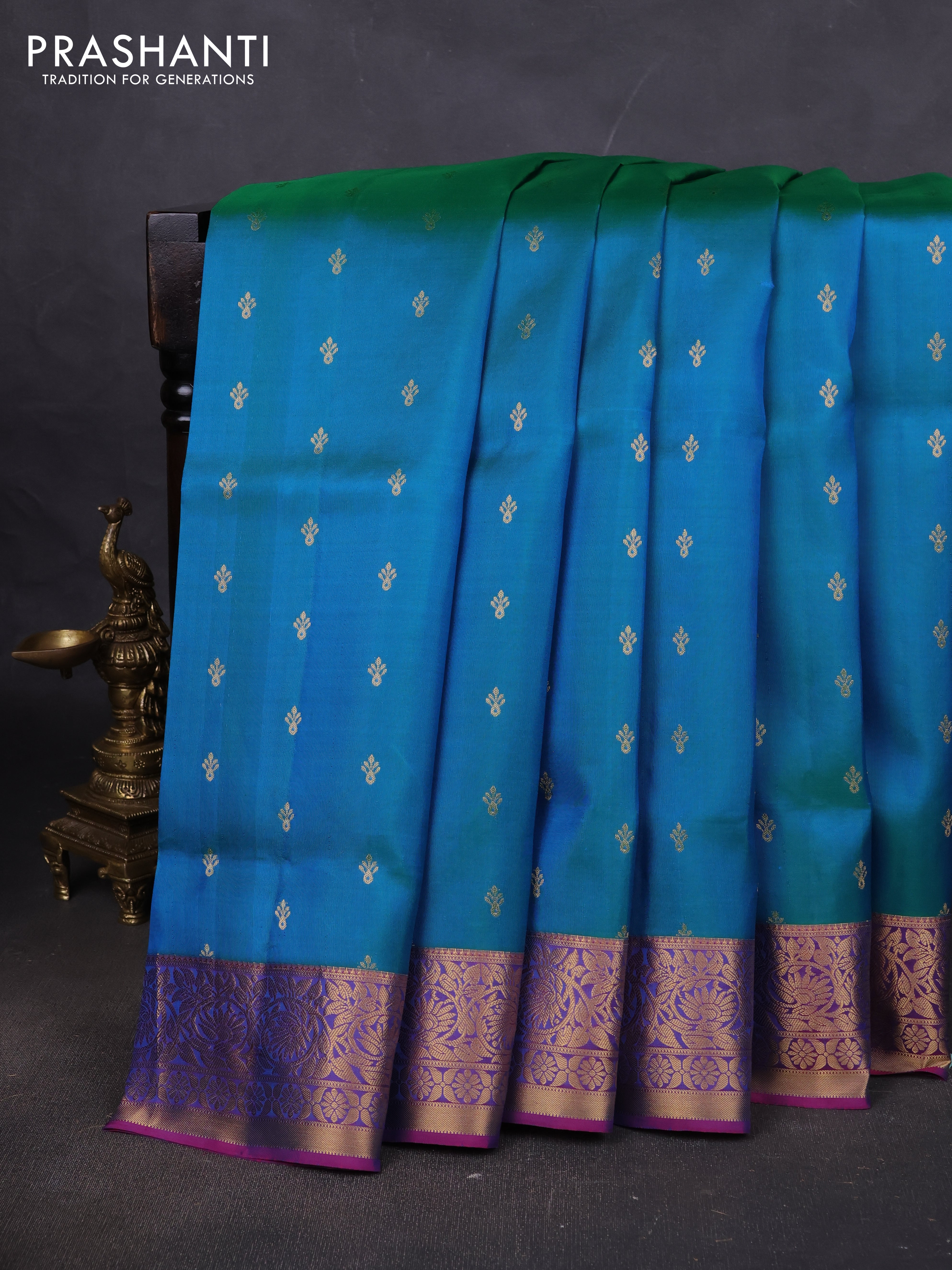 Pure soft silk saree dual shade of teal bluish green and purple with allover zari woven buttas and zari woven floral border