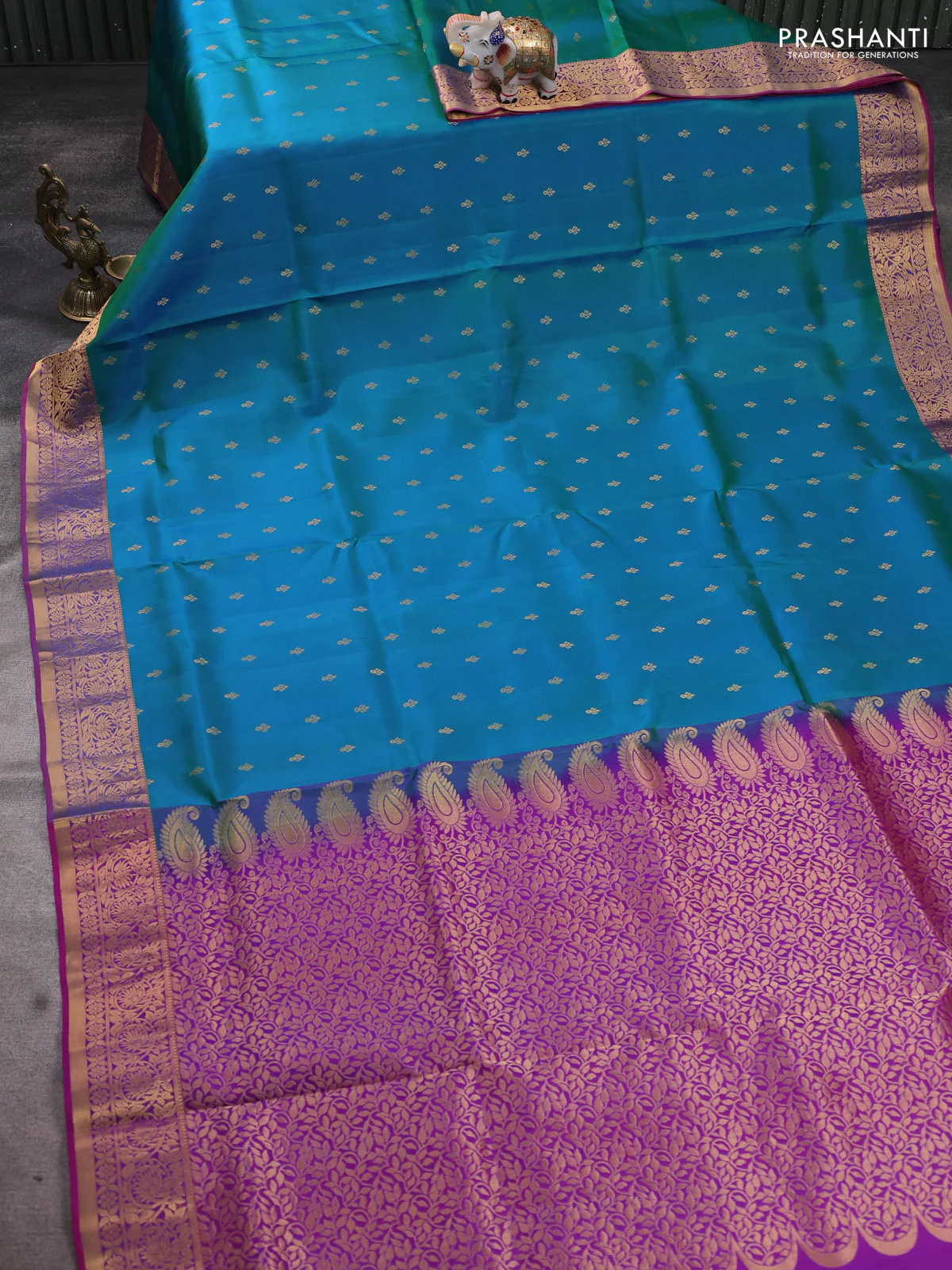 Pure soft silk saree dual shade of teal bluish green and purple with allover zari woven buttas and zari woven floral border - Image 2