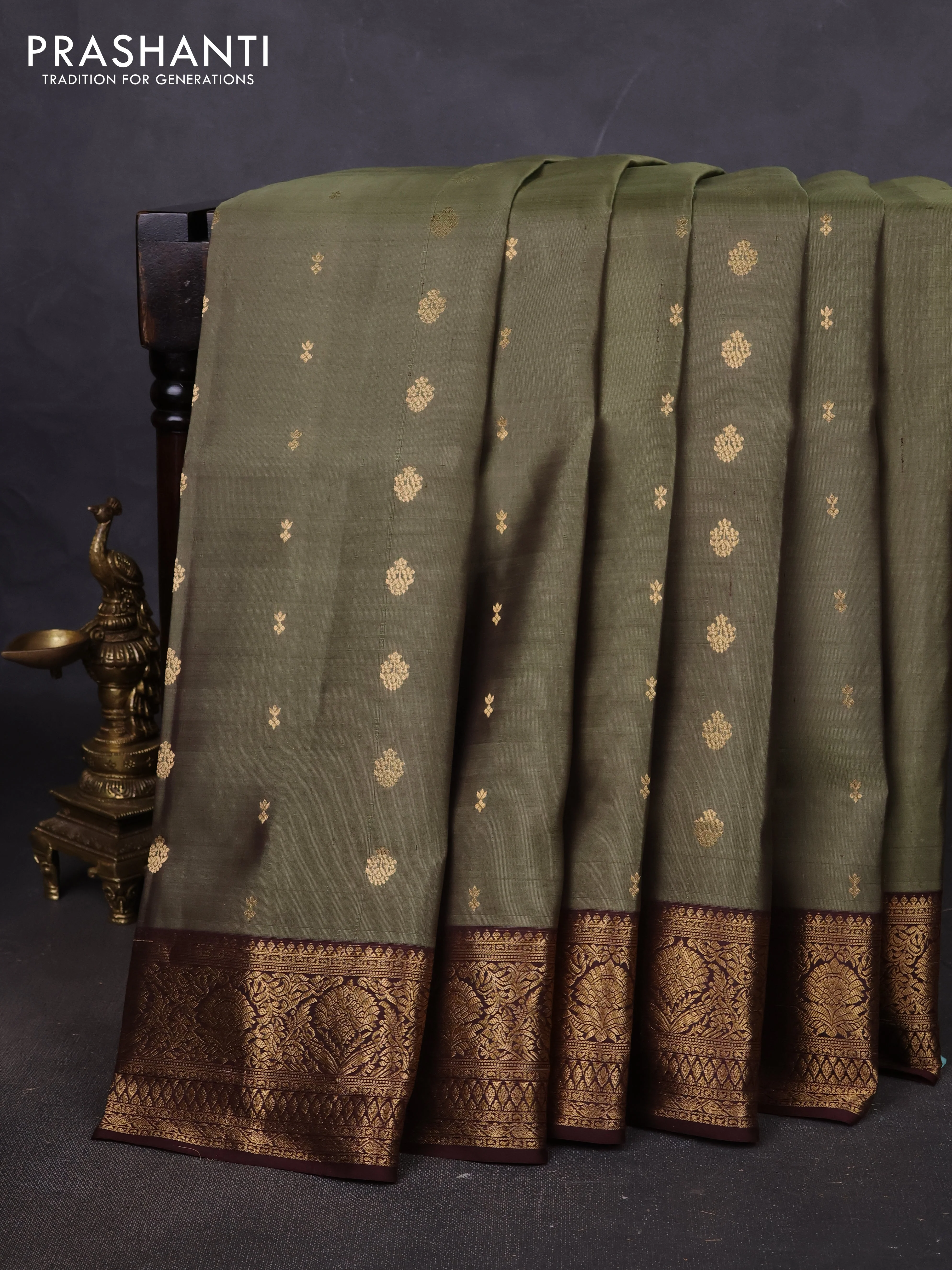 Pure soft silk saree elaichi green and coffee brown with allover zari woven buttas and rich zari woven border