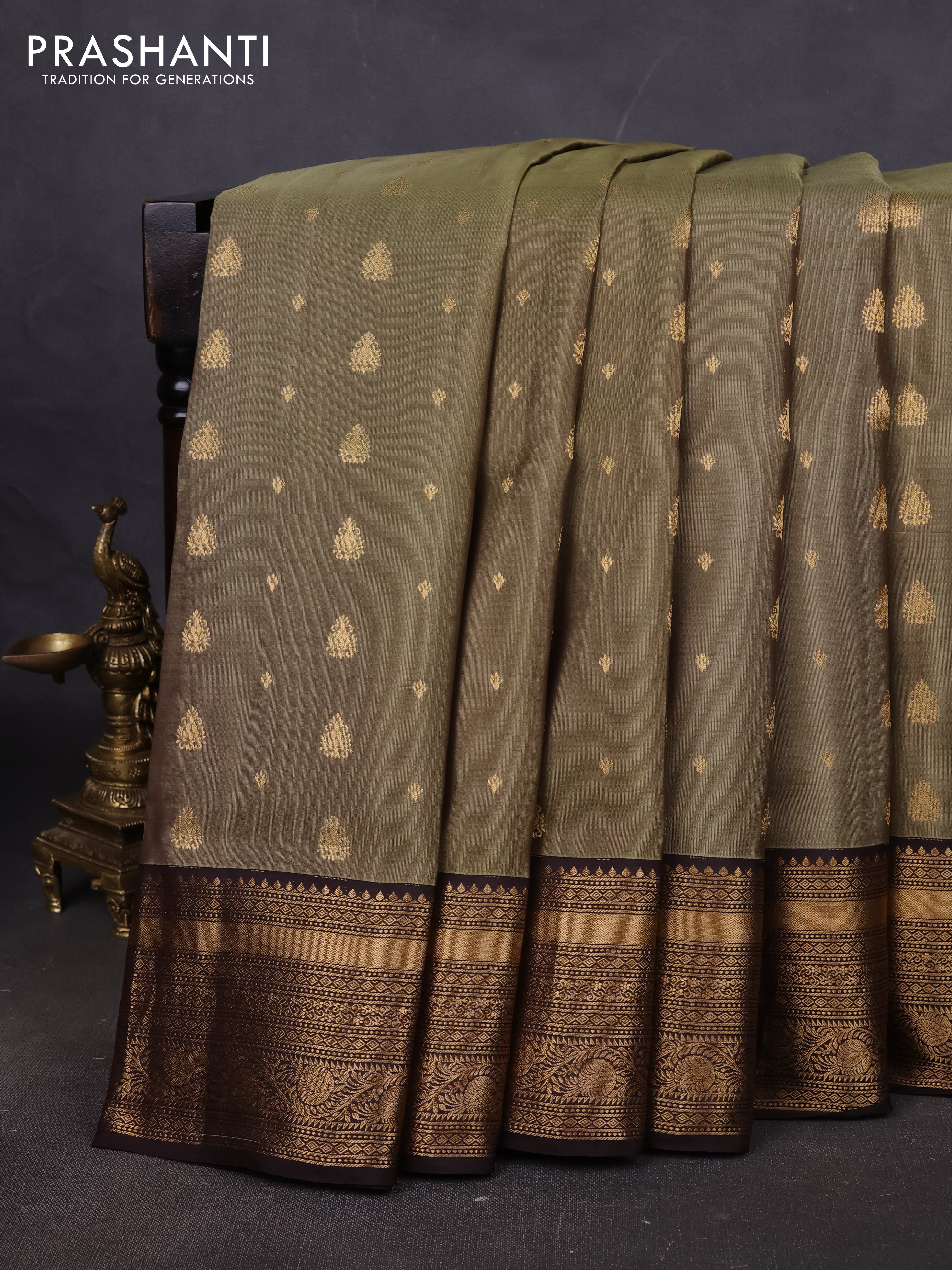 Pure soft silk saree elaichi green and coffee brown with allover zari woven buttas and rich zari woven border