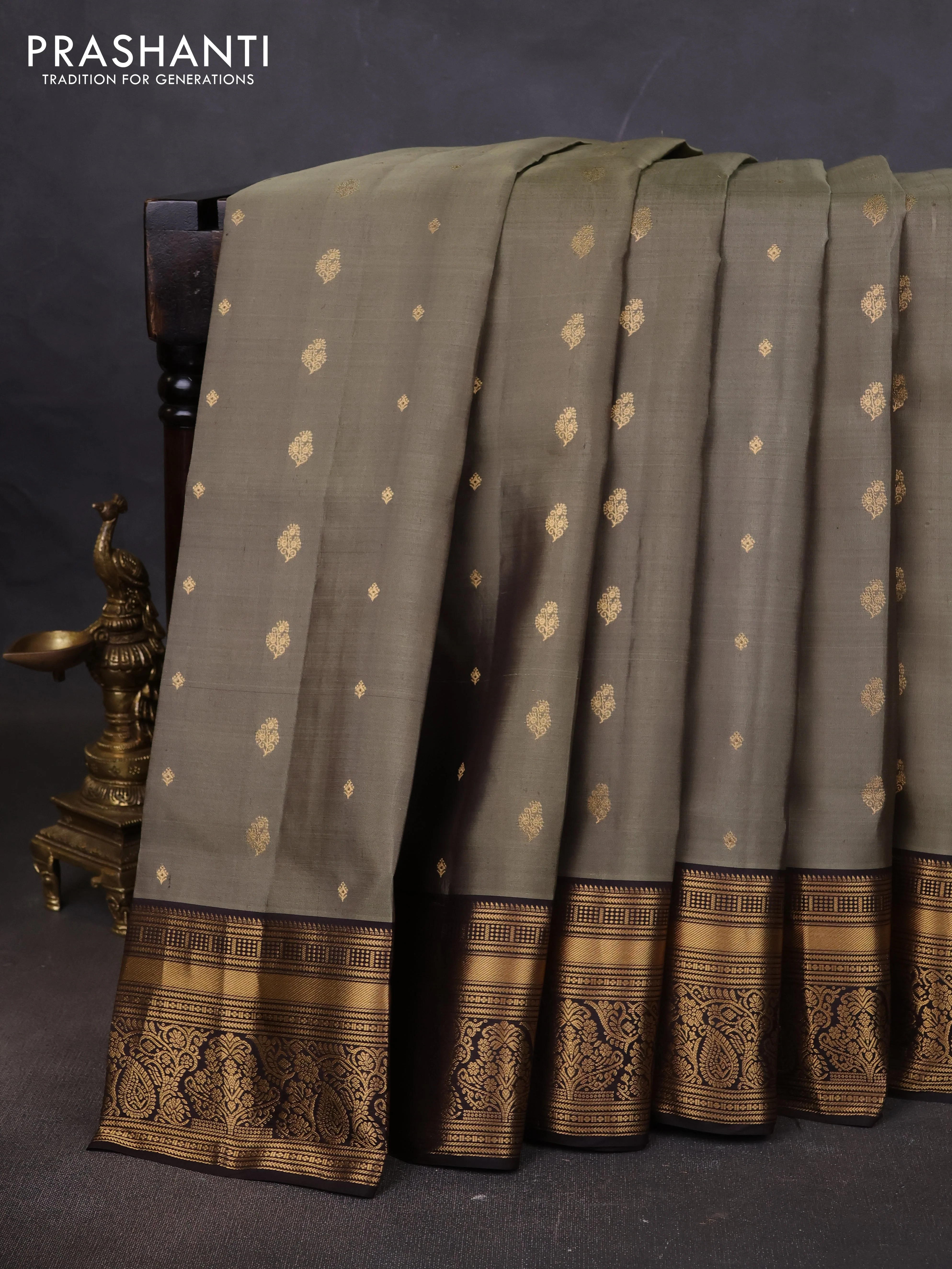 Pure soft silk saree elaichi green and coffee brown with allover zari woven buttas and rich zari woven border