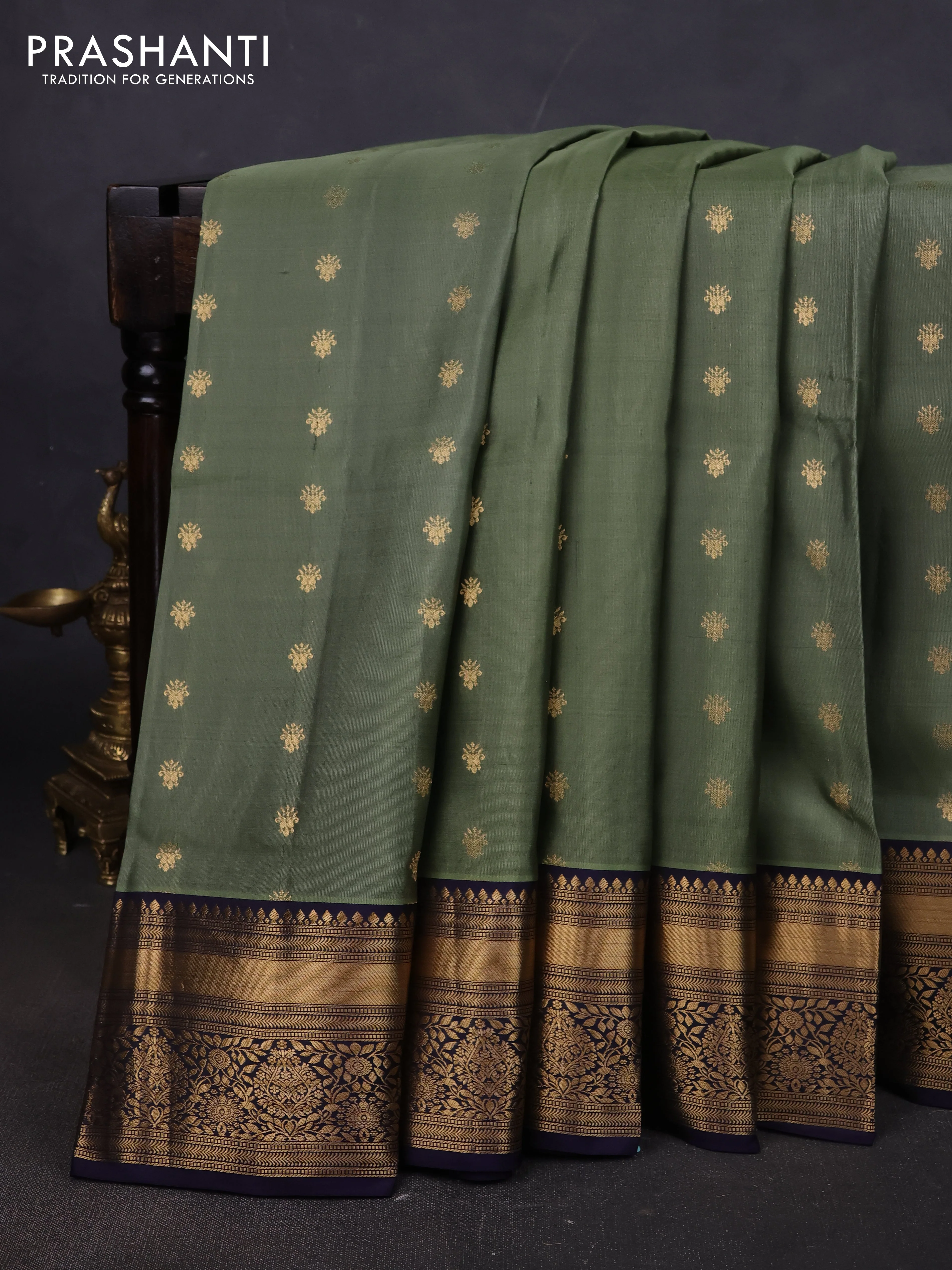 Pure soft silk saree elaichi green and navy blue with allover zari woven buttas and zari woven border