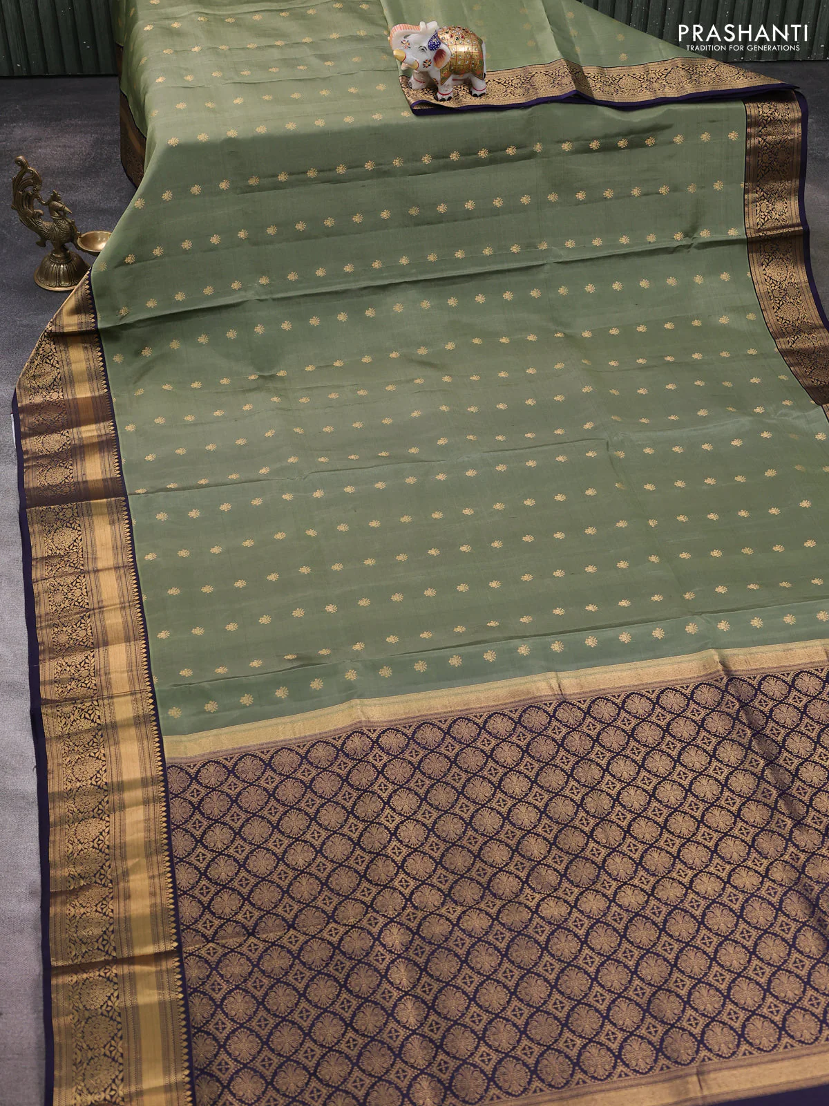 Pure soft silk saree elaichi green and navy blue with allover zari woven buttas and zari woven border - Image 2