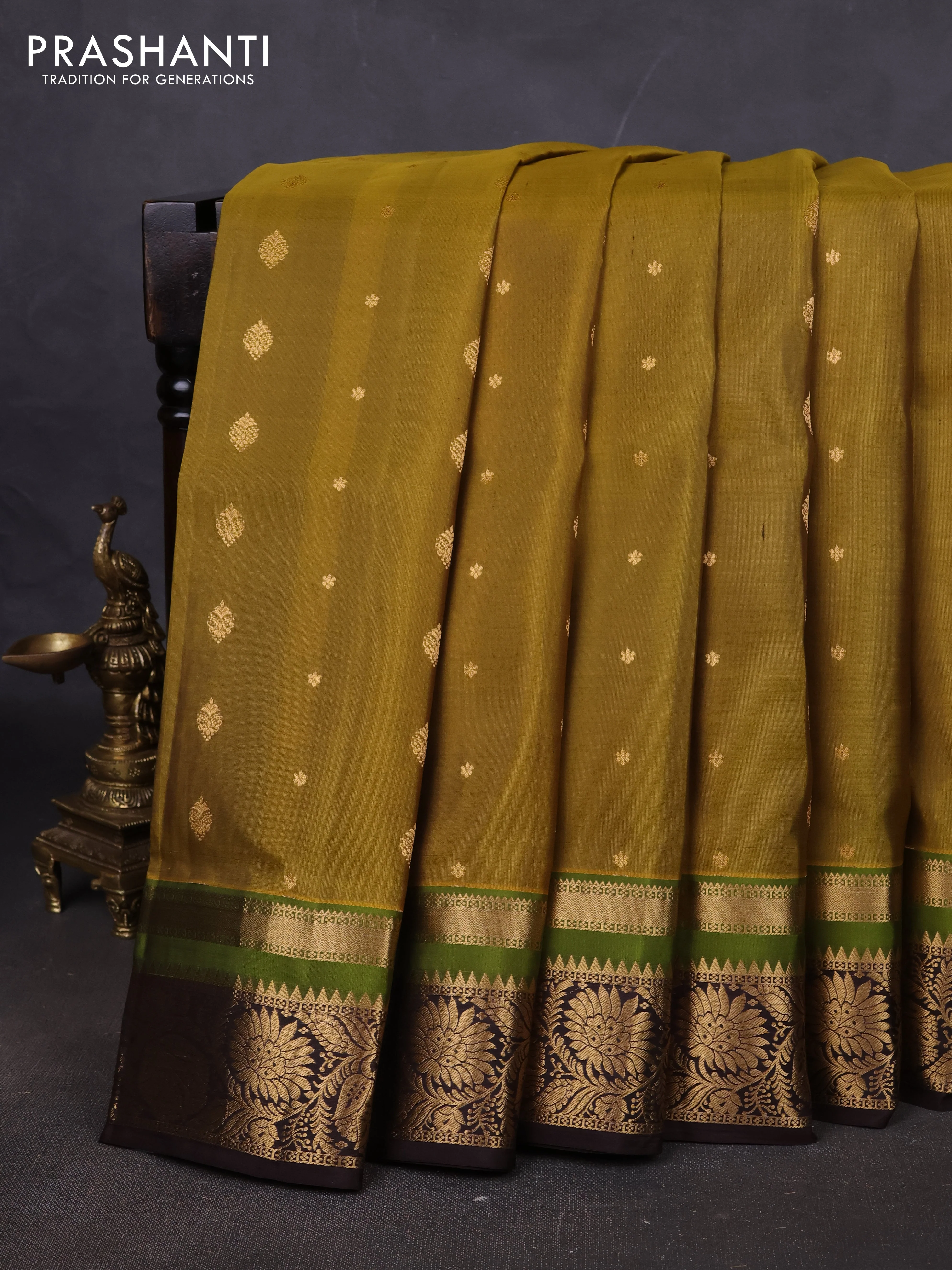 Pure soft silk saree mehendi green and coffee brown with allover zari woven buttas and zari woven floral border