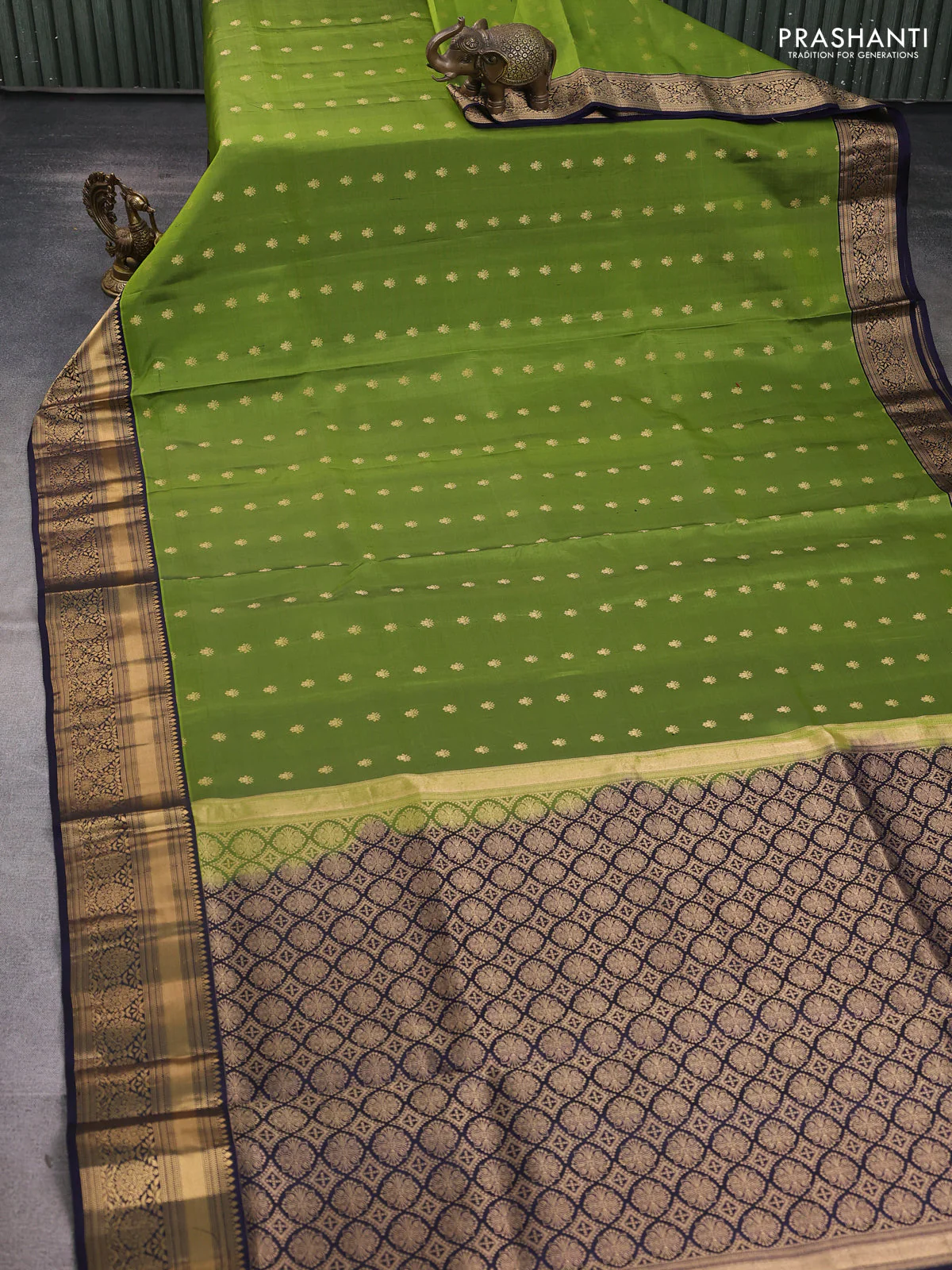 Pure soft silk saree mehendi green and navy blue with allover zari woven buttas and floral zari woven border - Image 2