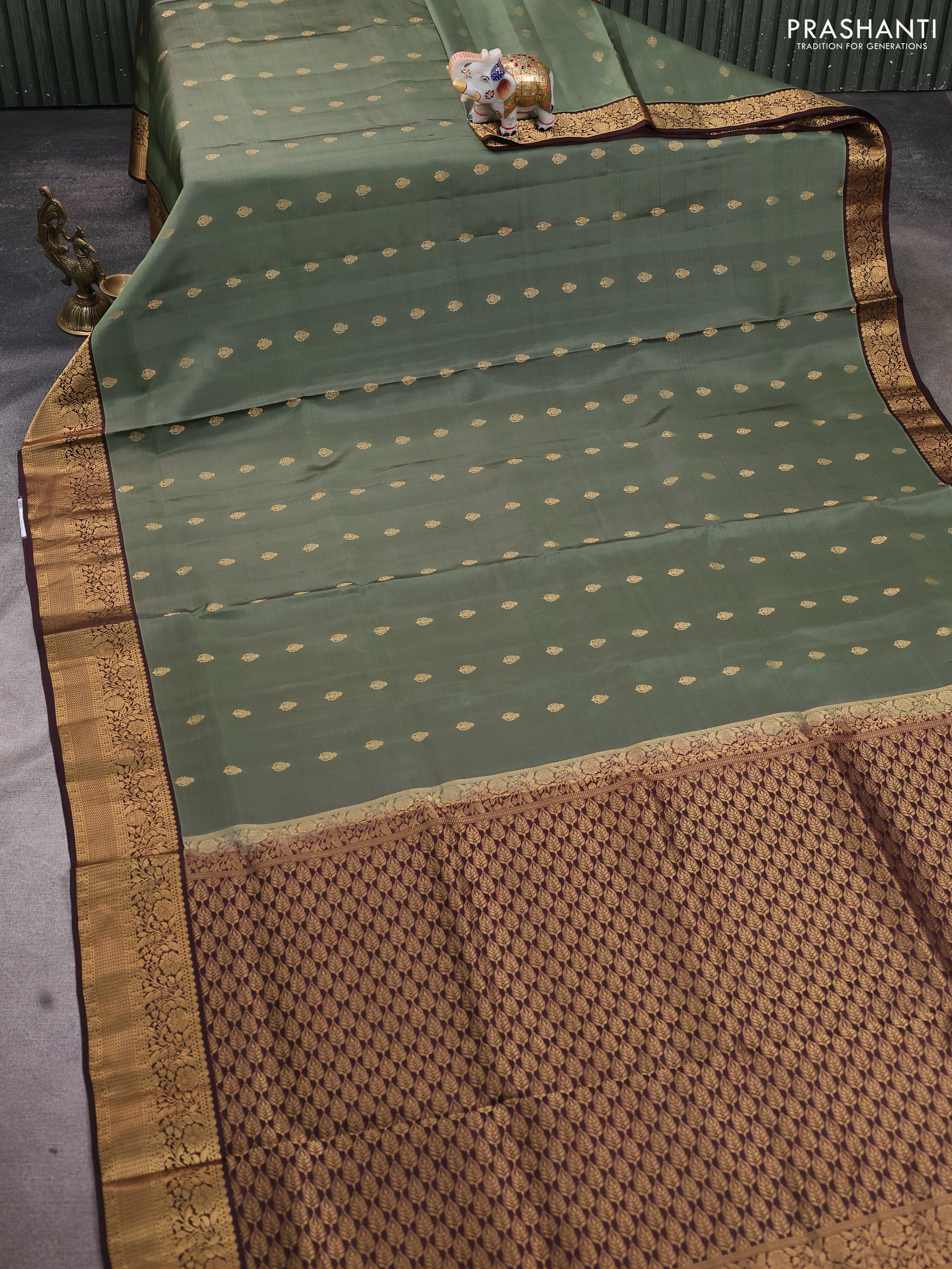 Pure soft silk saree pastel green and coffee brown with allover zari woven buttas and zari woven floral border - Image 2