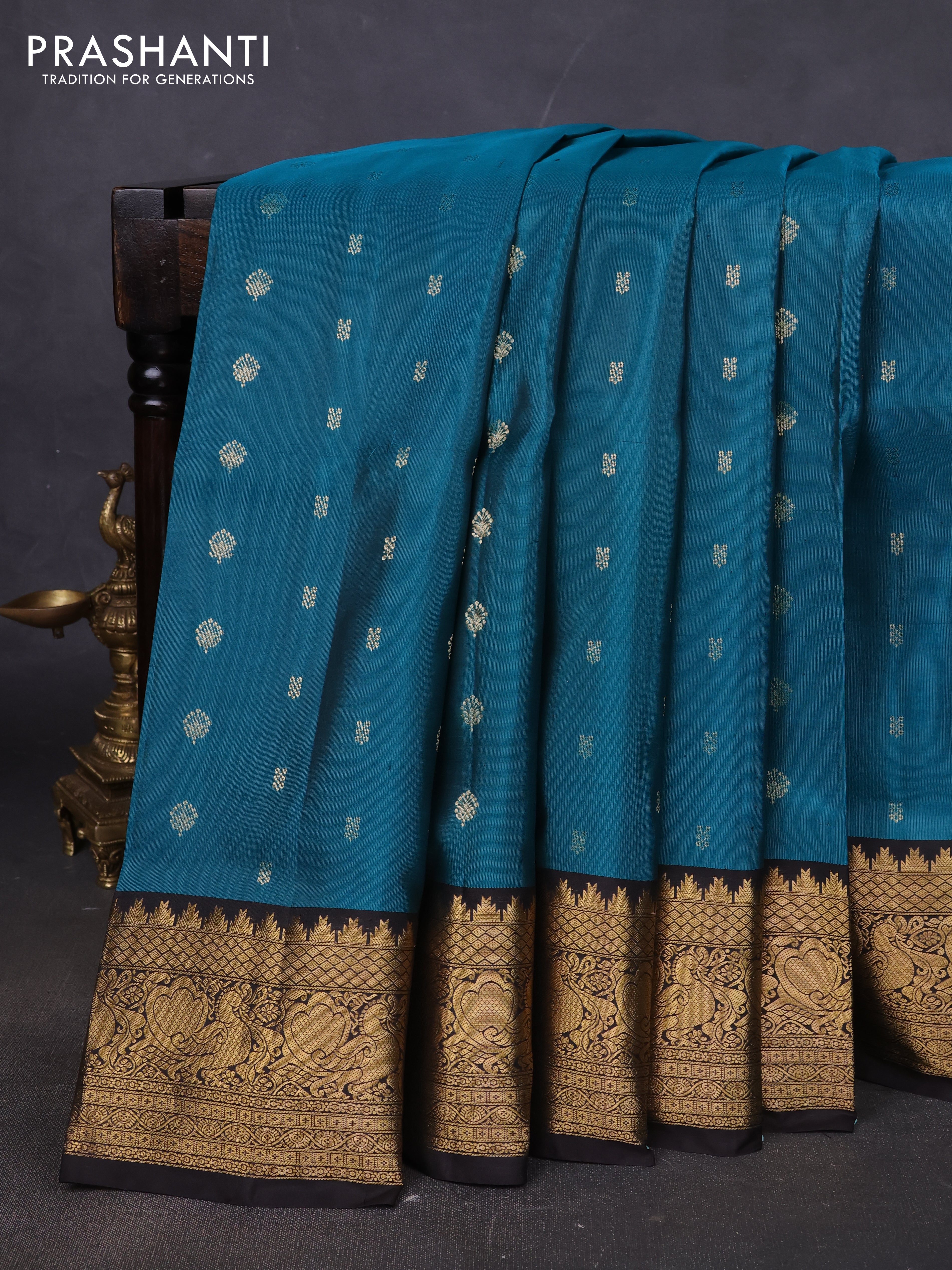 Pure soft silk saree peacock green and coffee brown with allover zari woven buttas and annam zari woven border