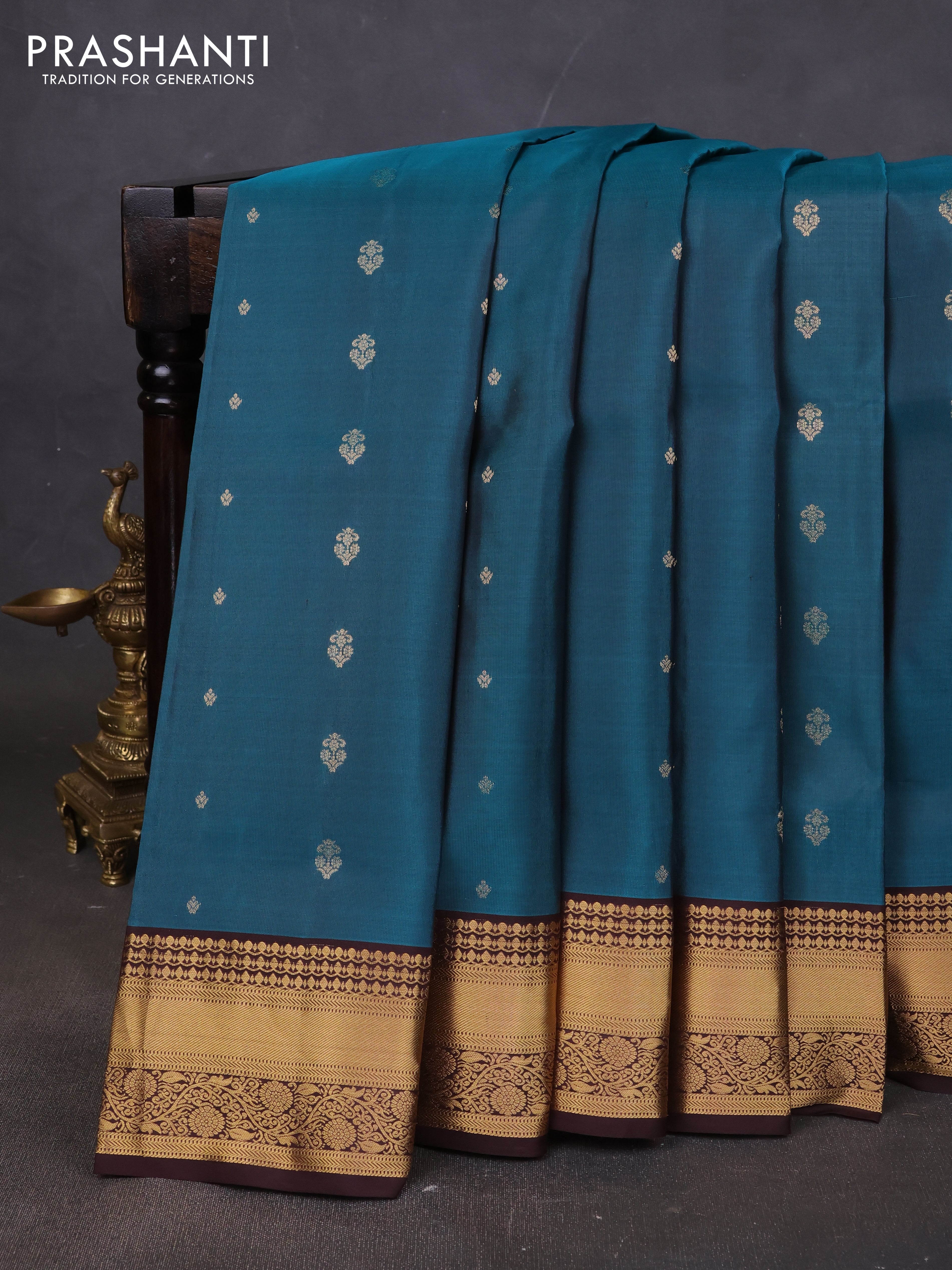 Pure soft silk saree peacock green and coffee brown with allover zari woven buttas and rich zari woven border