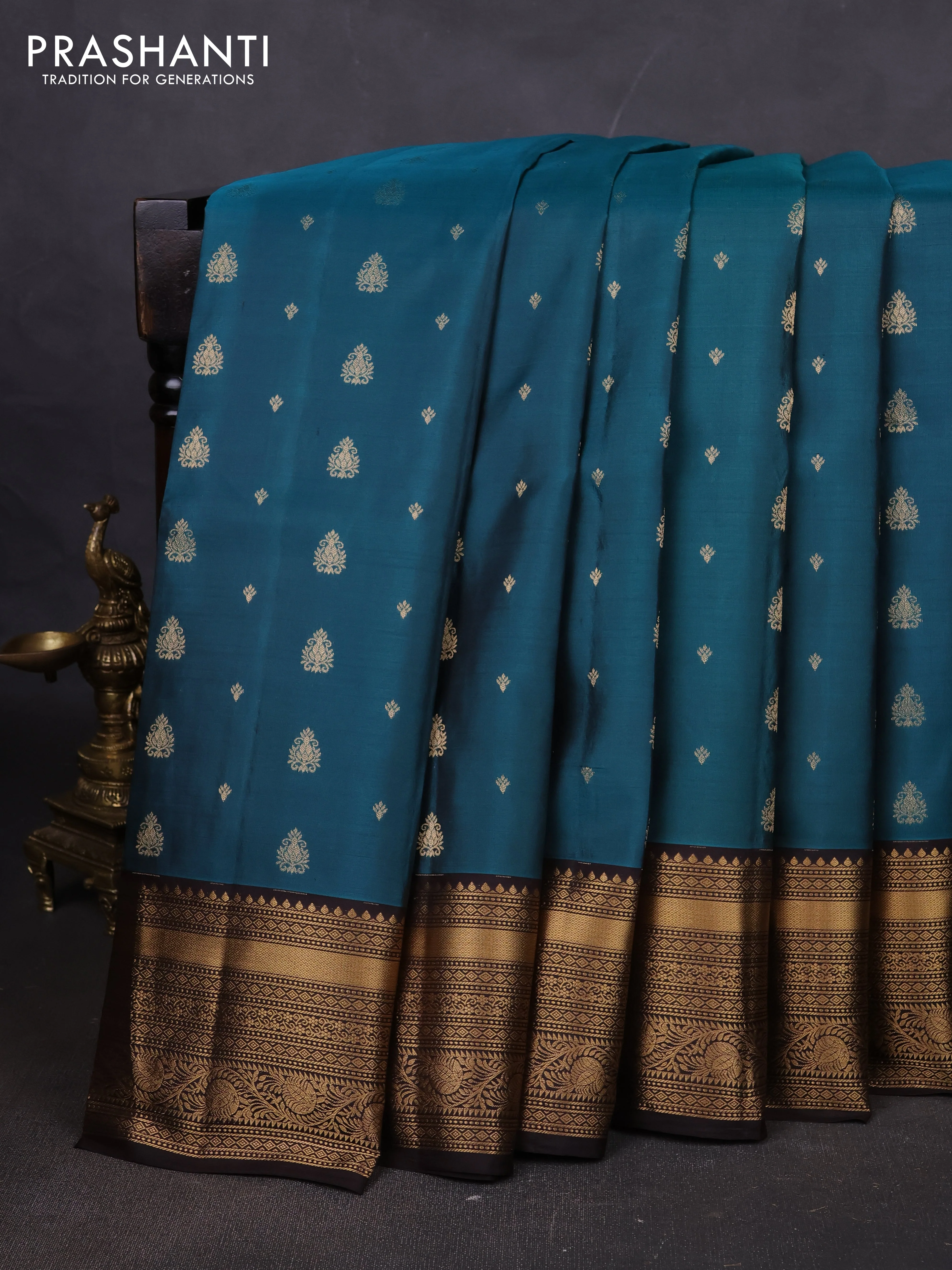 Pure soft silk saree peacock green and coffee brown with allover zari woven buttas and rich zari woven border