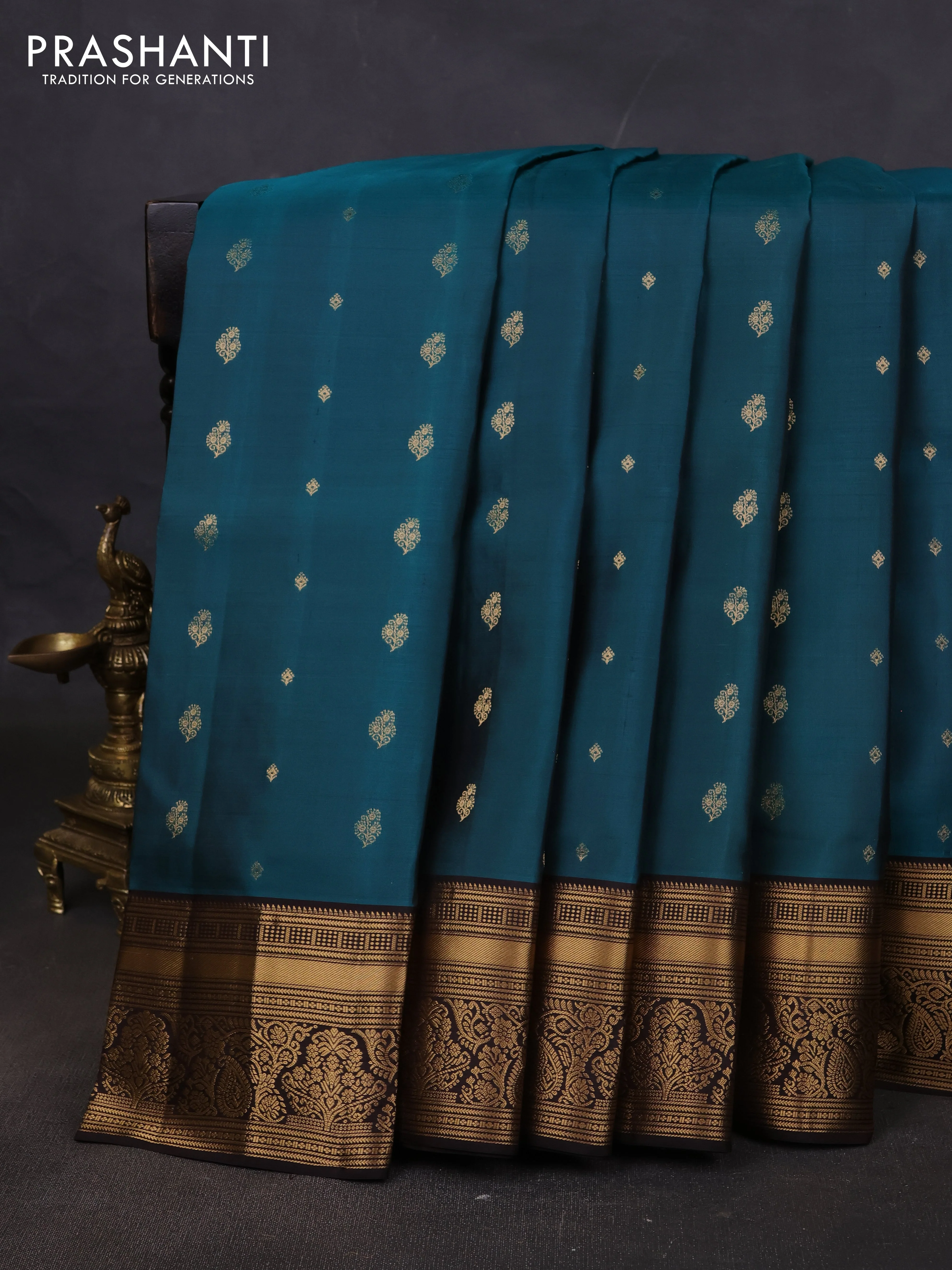 Pure soft silk saree peacock green and coffee brown with allover zari woven buttas and rich zari woven border