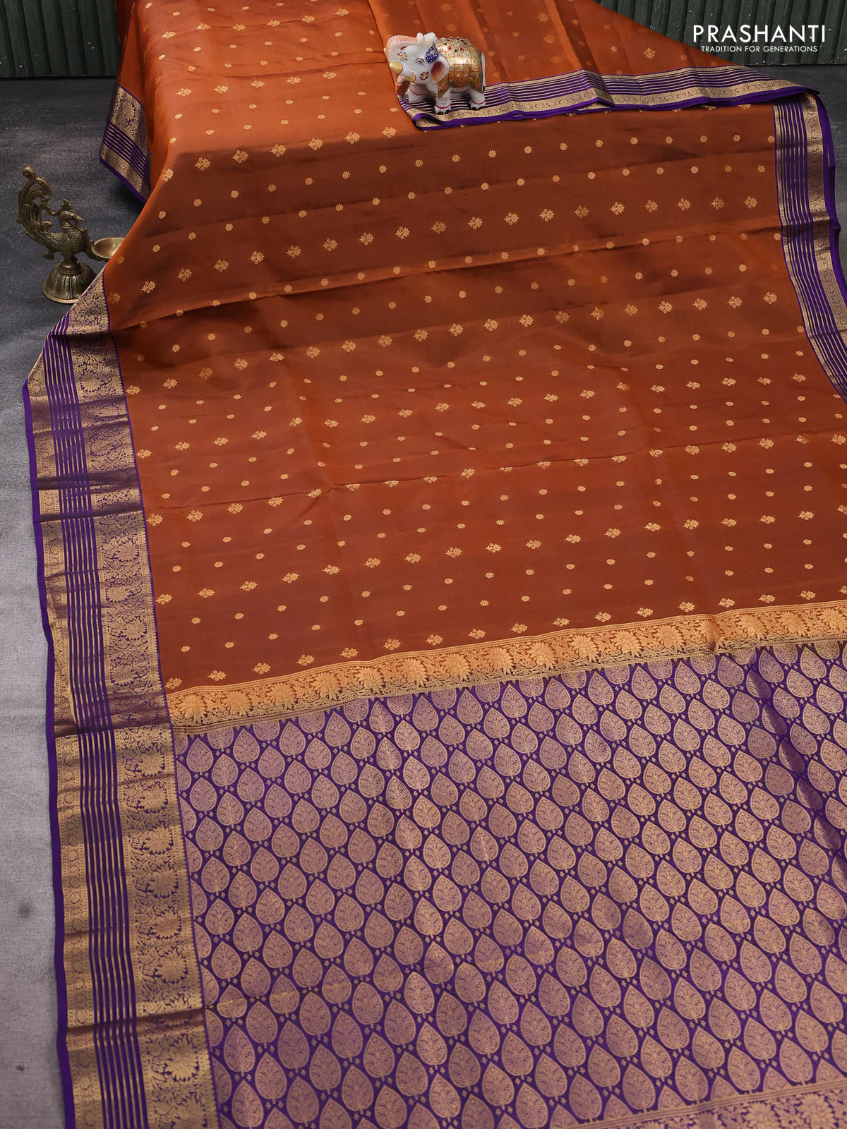 Pure soft silk saree rust shade and violet with allover zari woven buttas and floral zari woven border - Image 2
