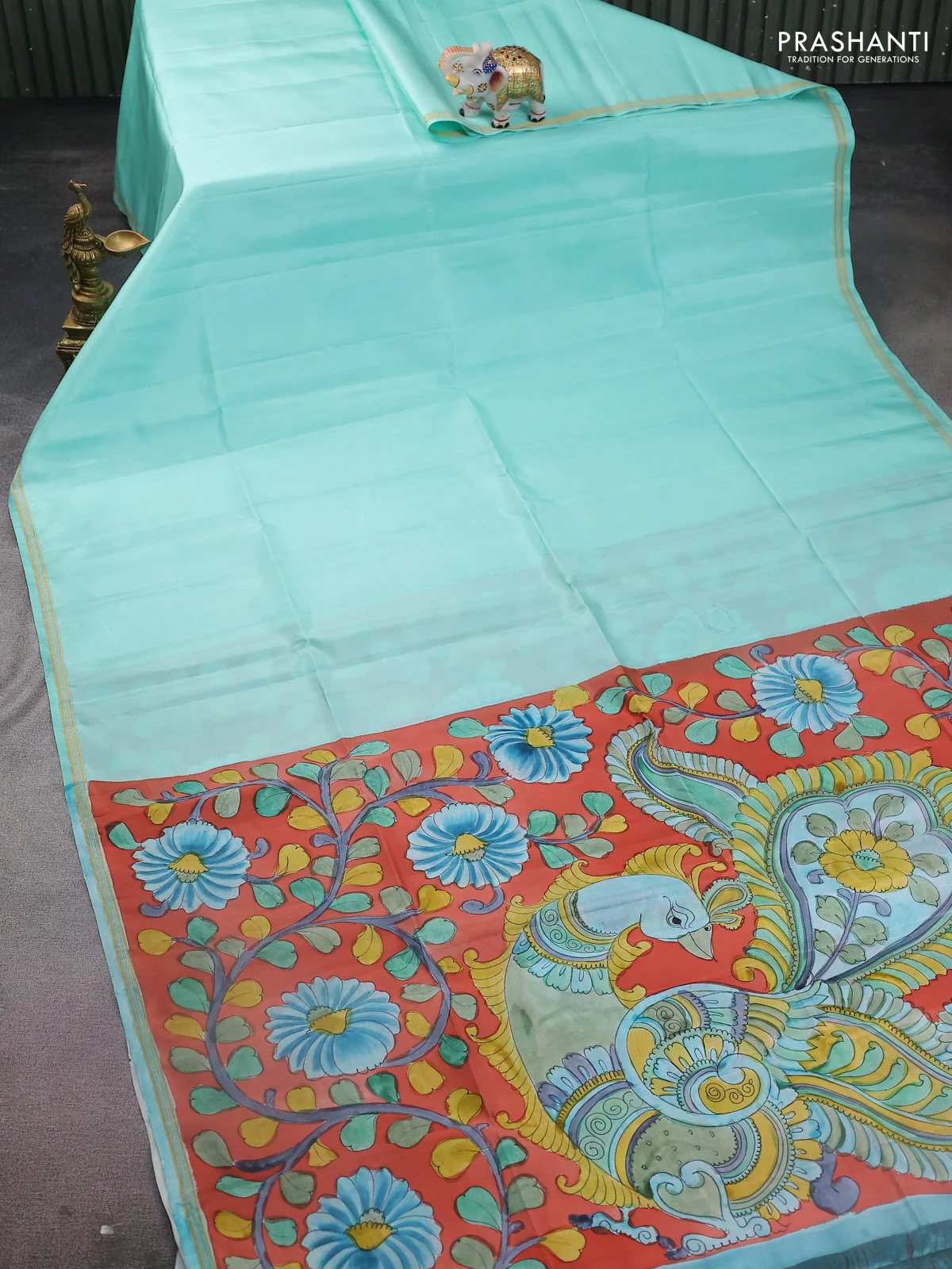 Pure soft silk saree teal blue and orange with plain body and kalamkari hand painted pallu