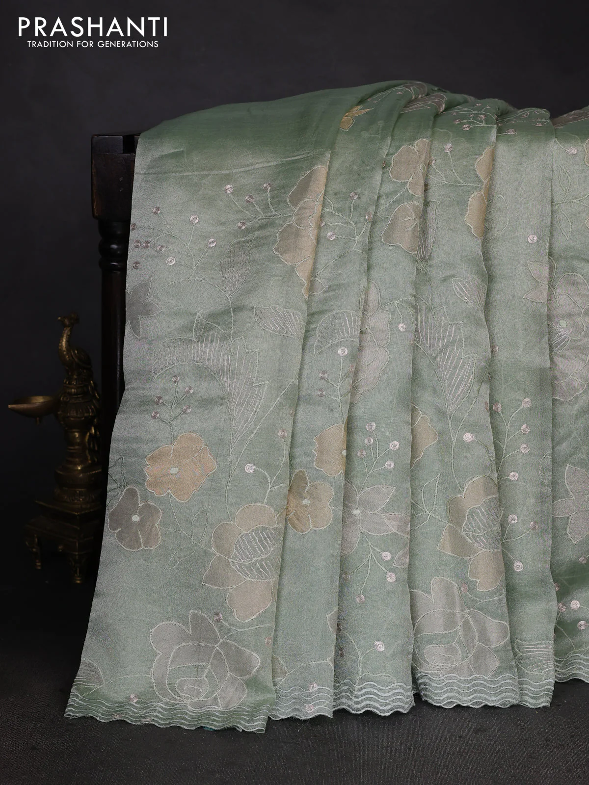 Pure tissue silk saree pastel green with allover floral embroidery work and simple embroidery border - Image 2