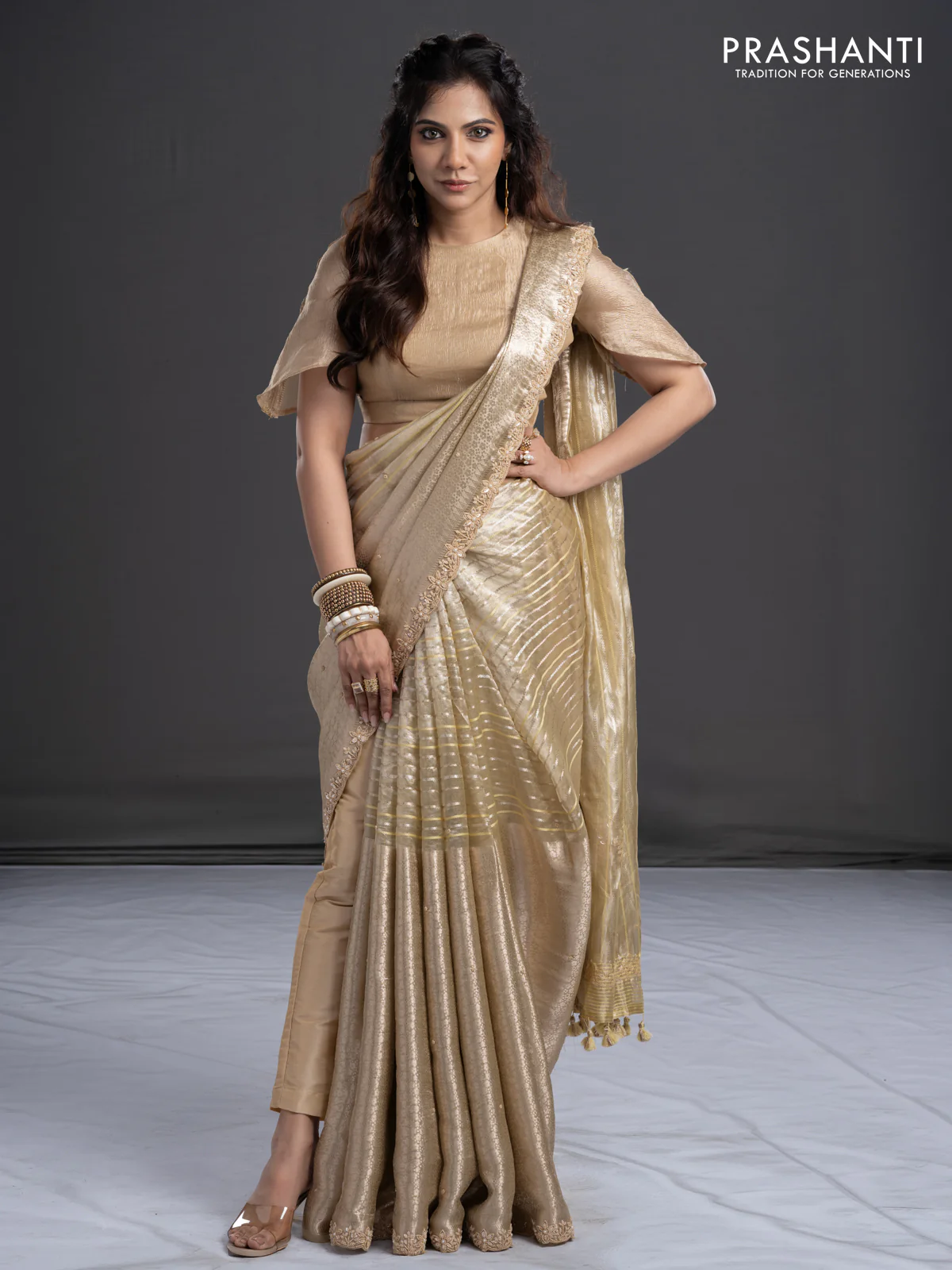 Pure tissue silk saree beige with Half & half style zari weaves and beaded work border