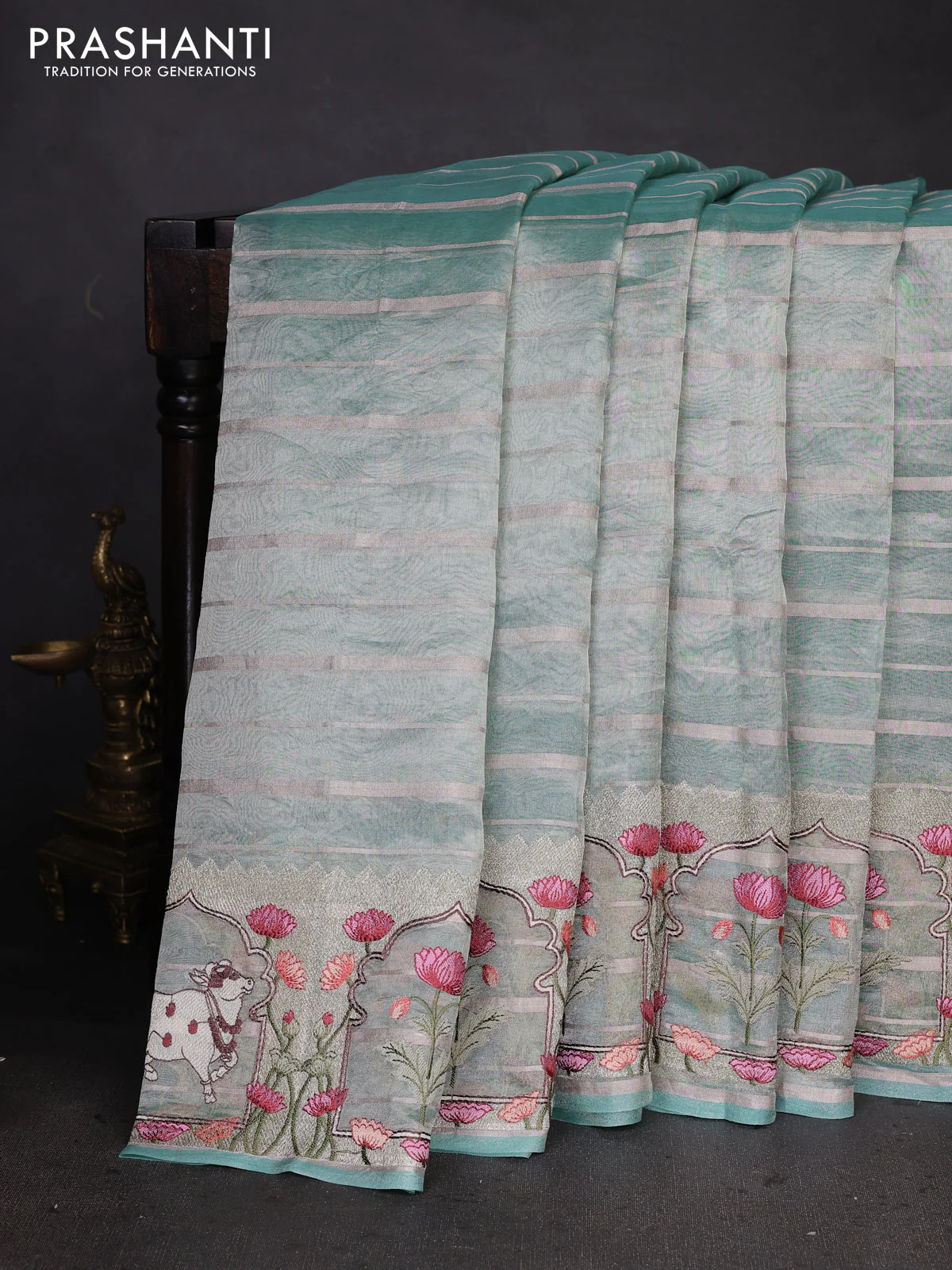 Pure tissue silk saree teal blue with allover silver zari strip pattern & beaded work and pichwai embroidery border - Image 2