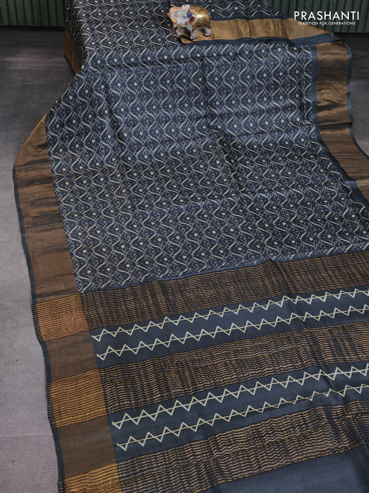 Pure tussar saree dark grey with allover prints and zari woven border - Image 2