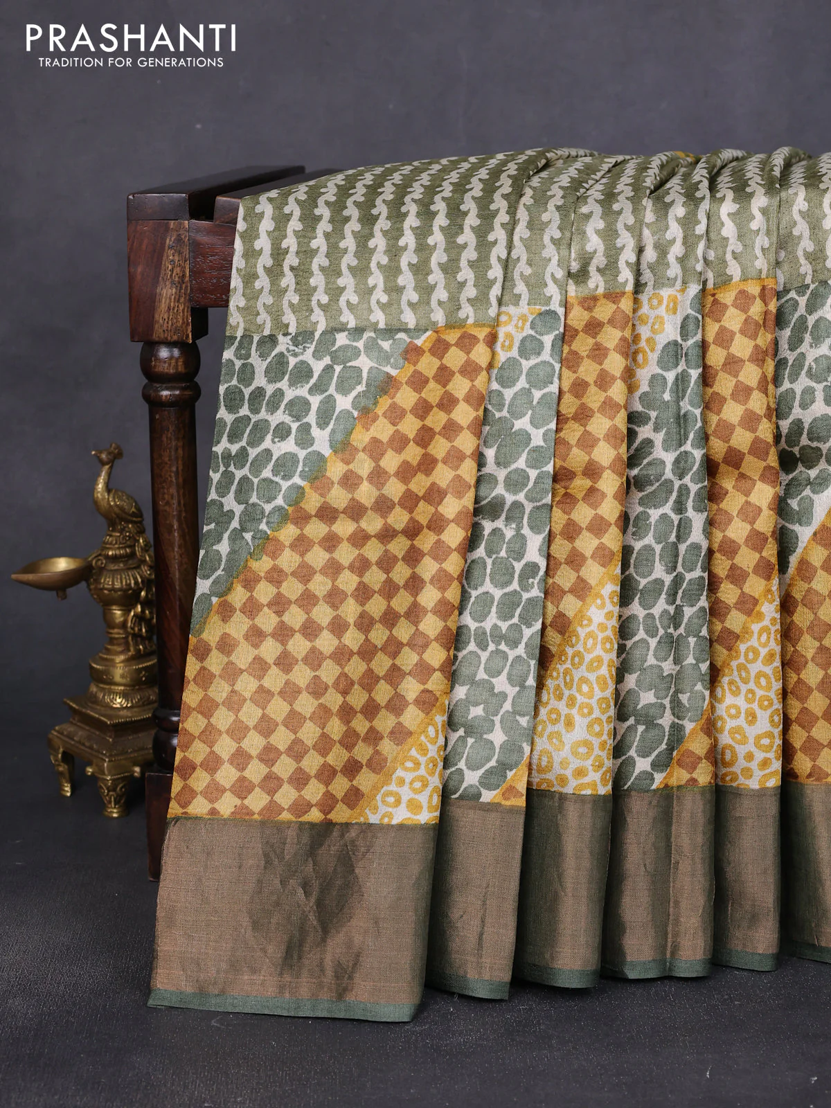 Pure tussar saree green with allover prints and zari woven border