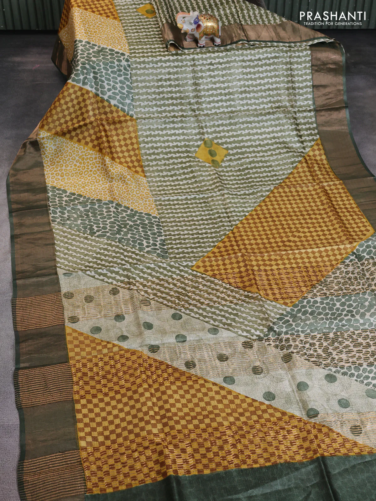 Pure tussar saree green with allover prints and zari woven border - Image 2