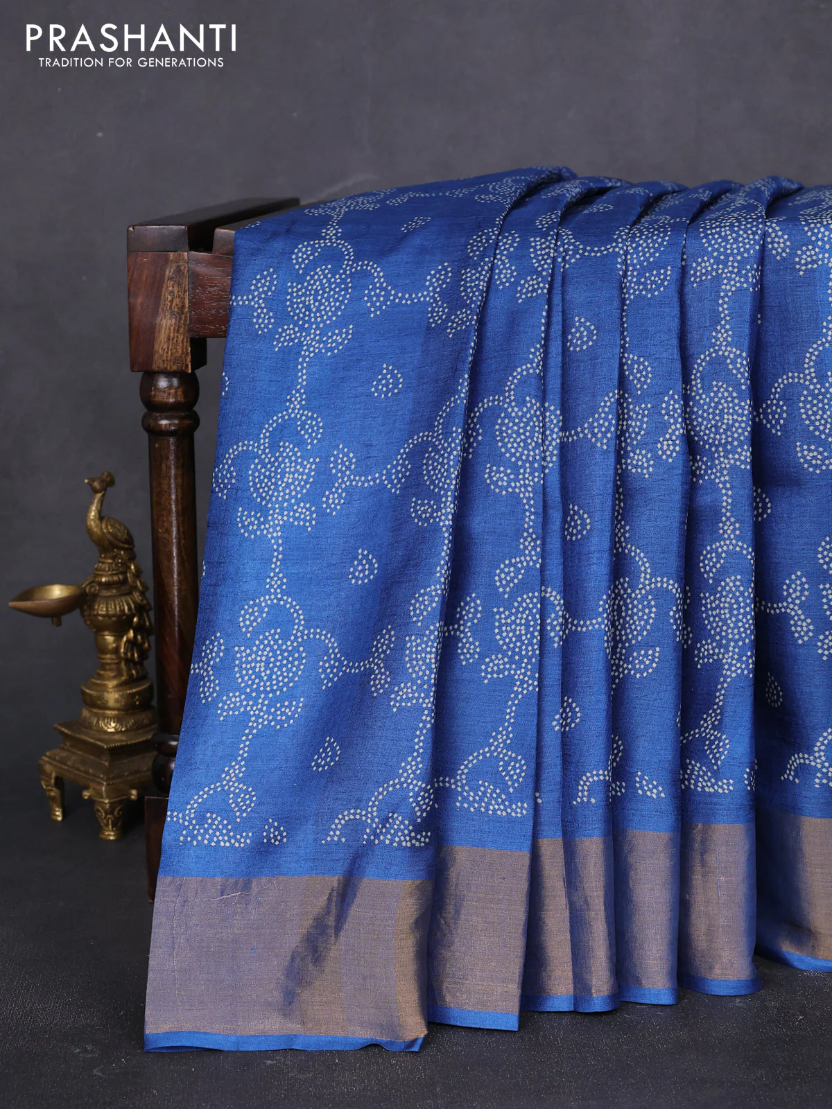 Pure tussar saree peacock blue with allover prints and zari woven border