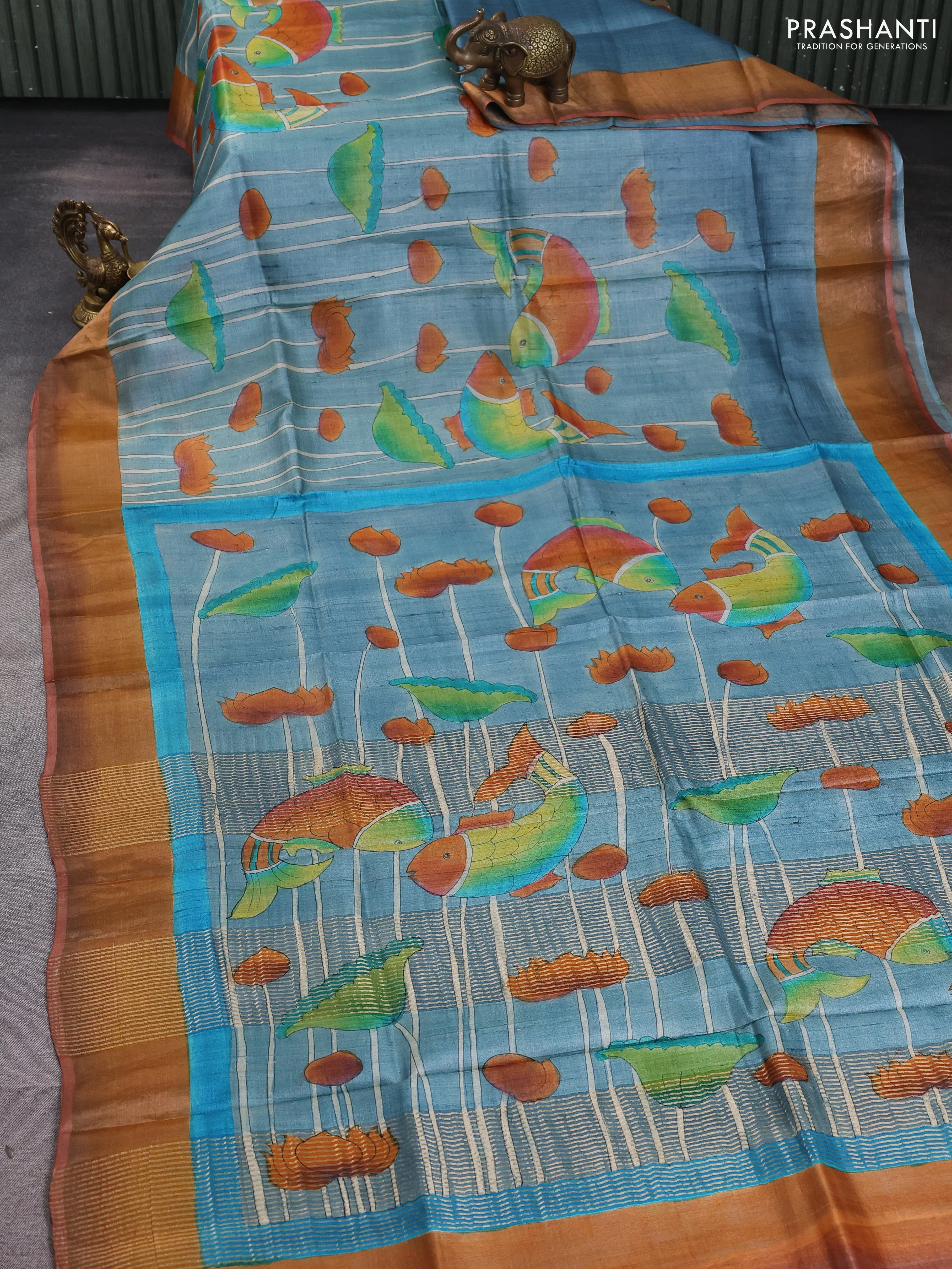 Pure tussar silk saree bluish grey and rust shade with allover hand painted prints and zari woven border - Image 2