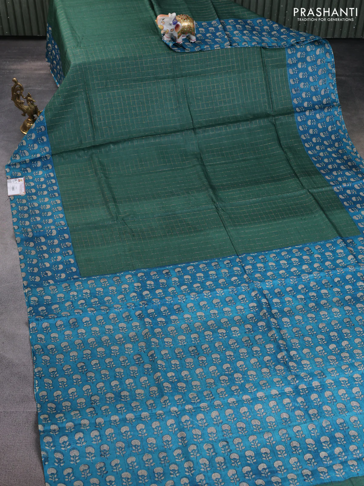 Pure tussar silk saree dark green and cs blue with allover zari checked pattern and floral printed border - Image 2