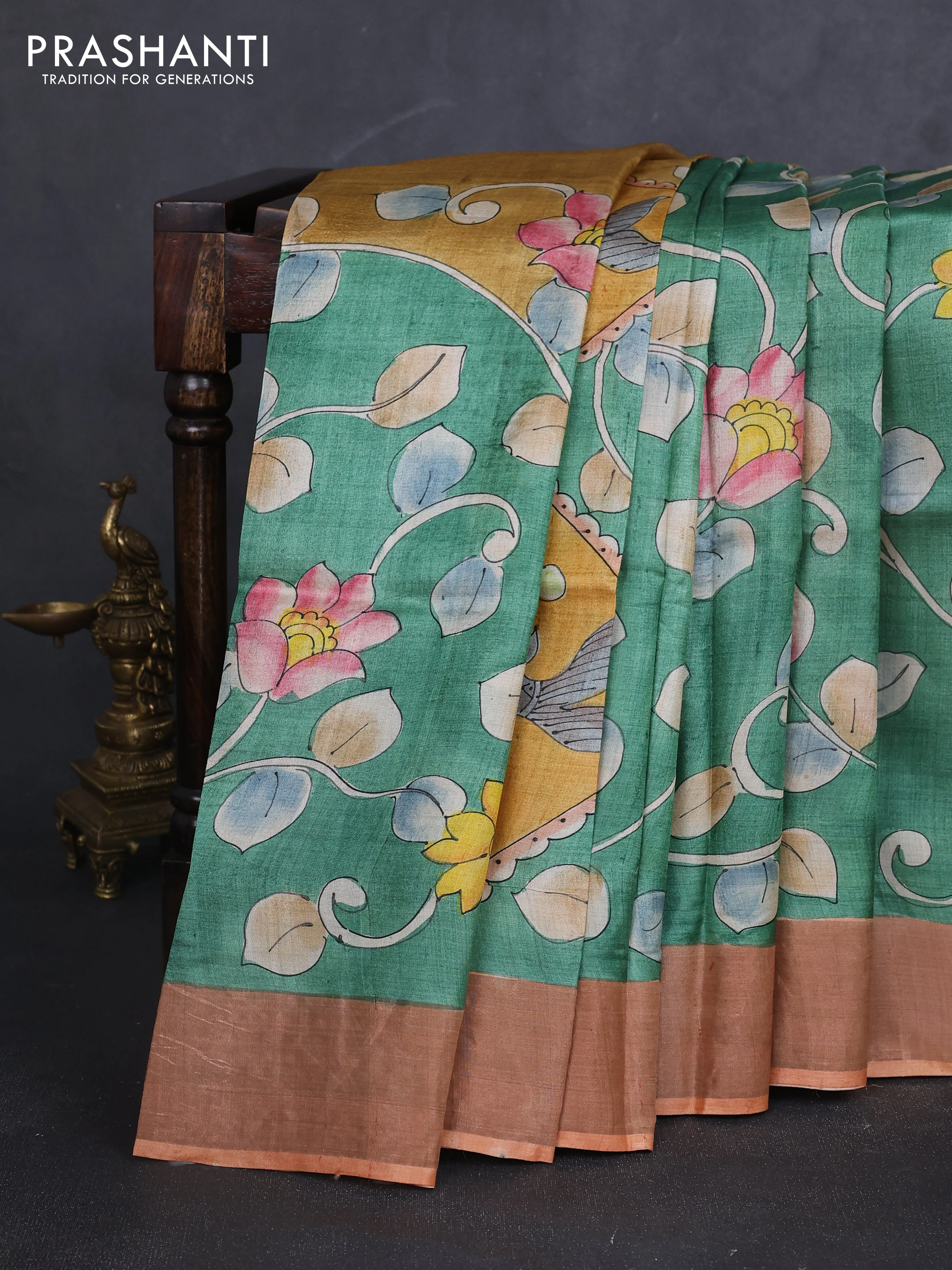 Pure tussar silk saree green and orange with allover kalamkari hand painted prints and zari woven border