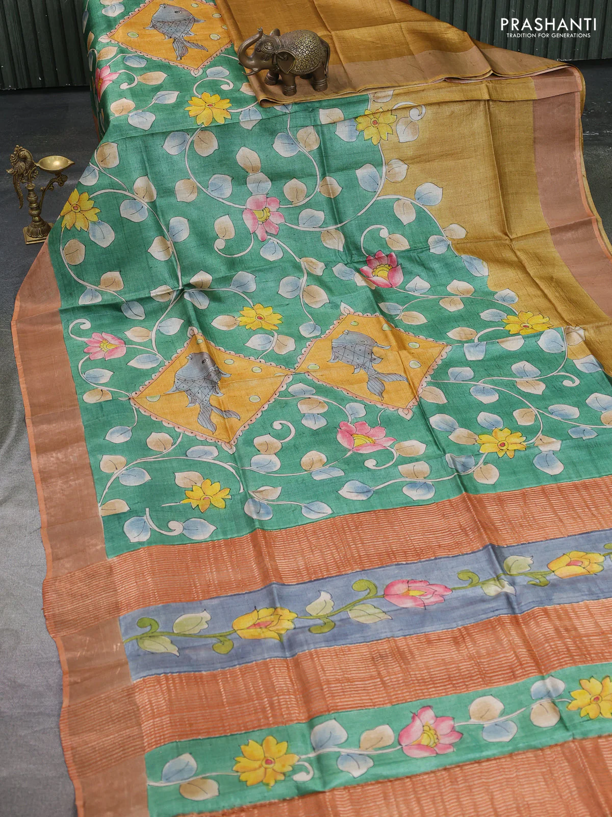 Pure tussar silk saree green and orange with allover kalamkari hand painted prints and zari woven border - Image 2