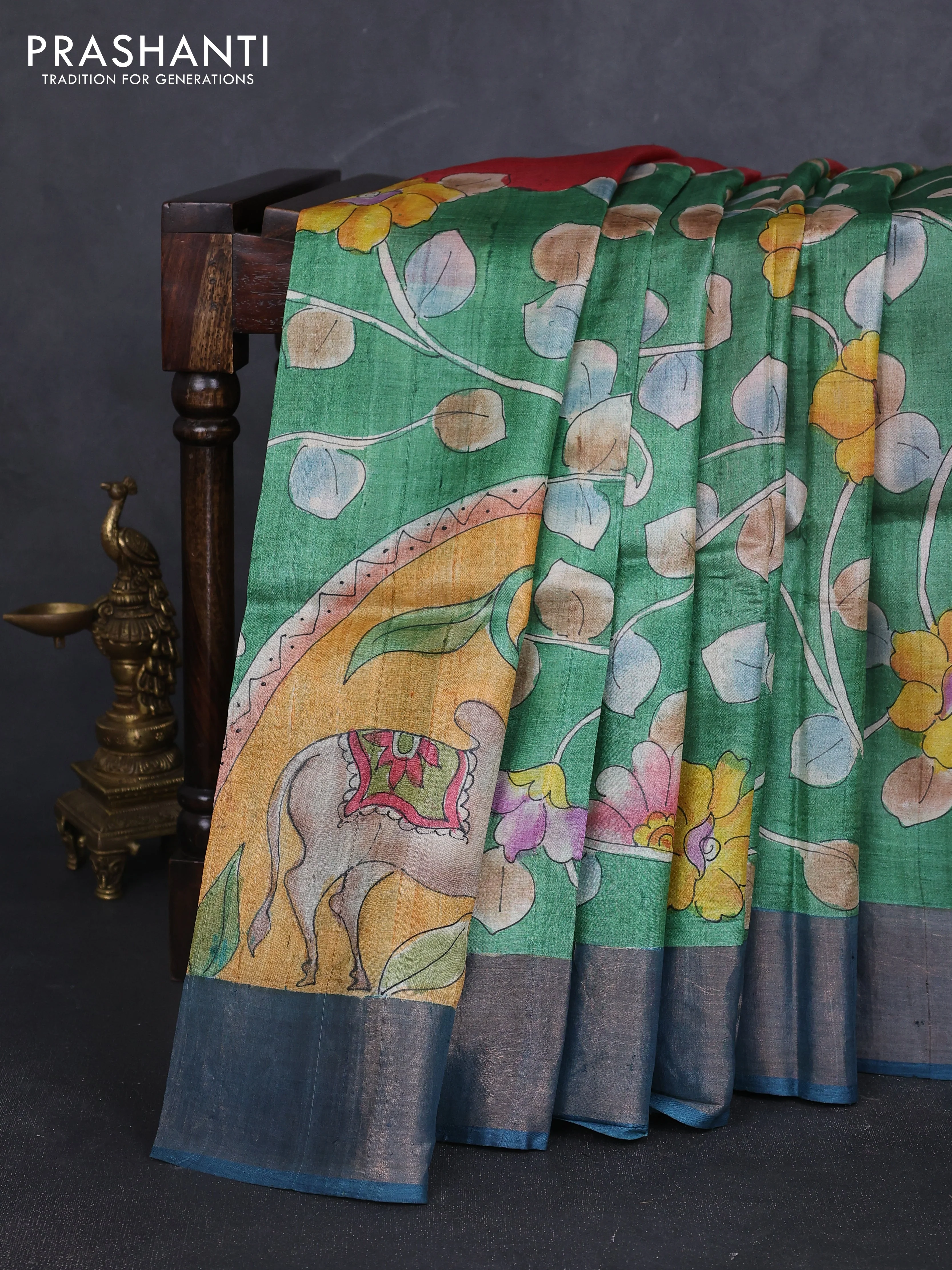 Pure tussar silk saree green and peacock blue with allover pichwai hand painted prints and zari woven border