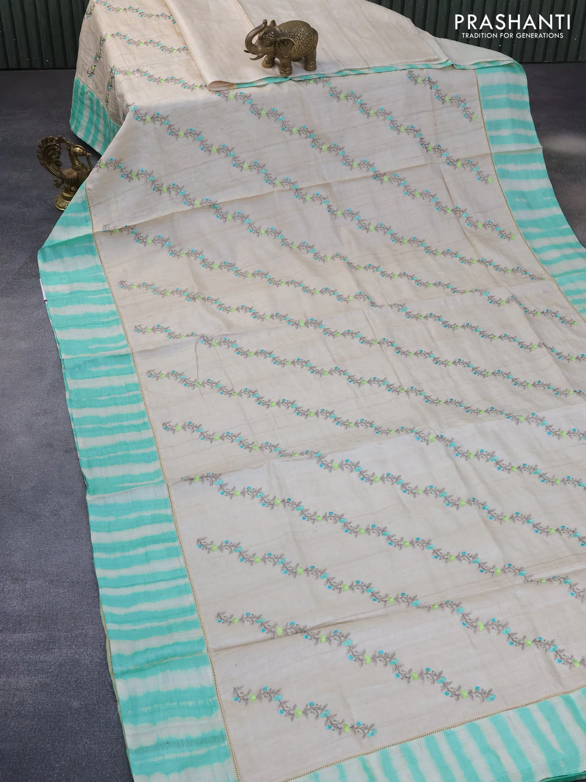 Pure tussar silk saree off white and teal green with allover embroidery work and tie & dye border - Image 3