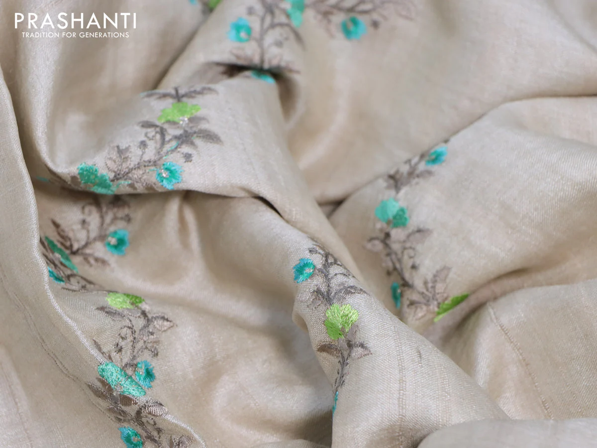 Pure tussar silk saree off white and teal green with allover embroidery work and tie & dye border - Image 4
