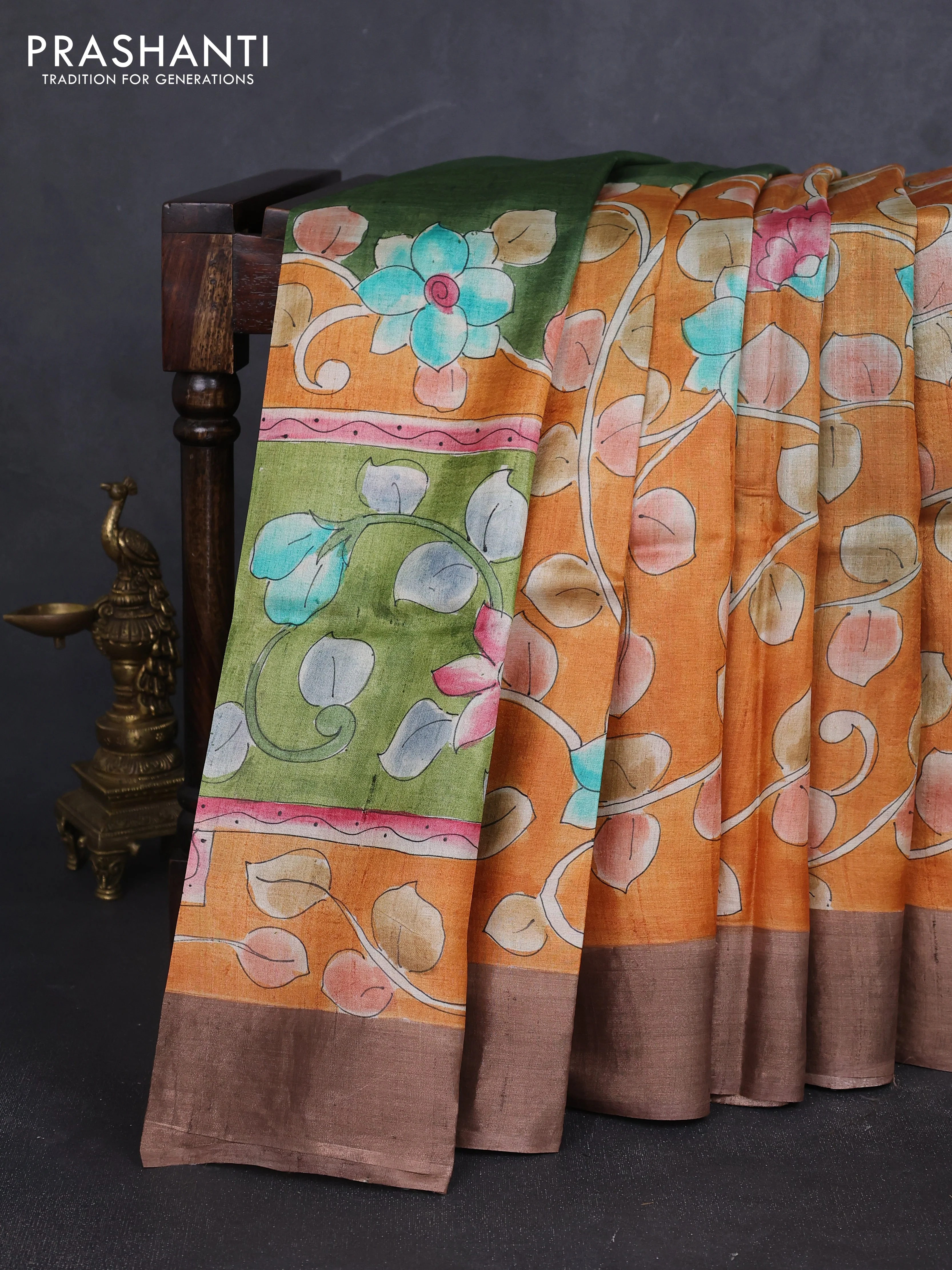 Pure tussar silk saree orange and brown with allover pichwai hand painted prints and zari woven border