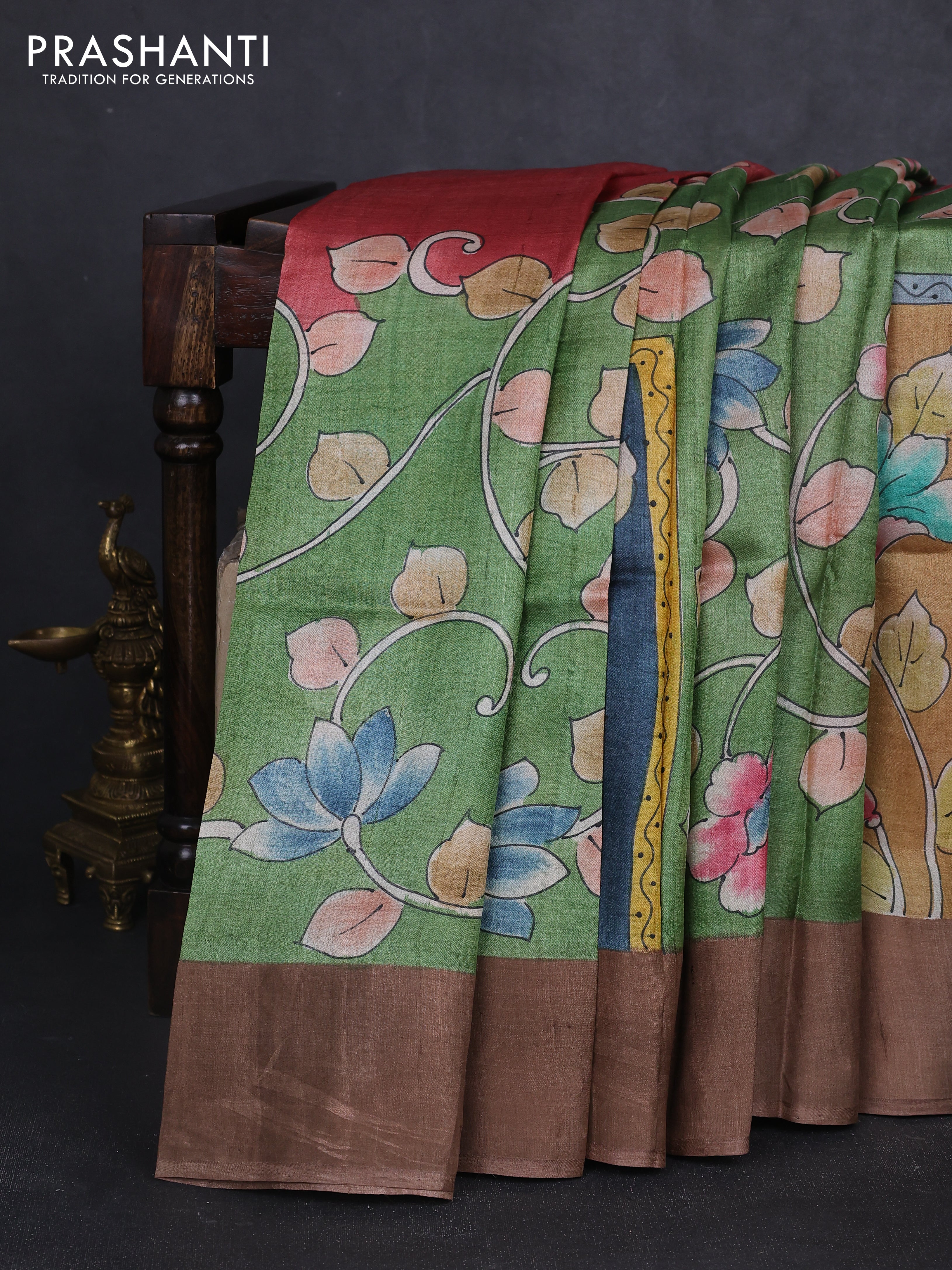 Pure tussar silk saree pastel green and dark sandal with allover kalamkari hand painted prints and zari woven border