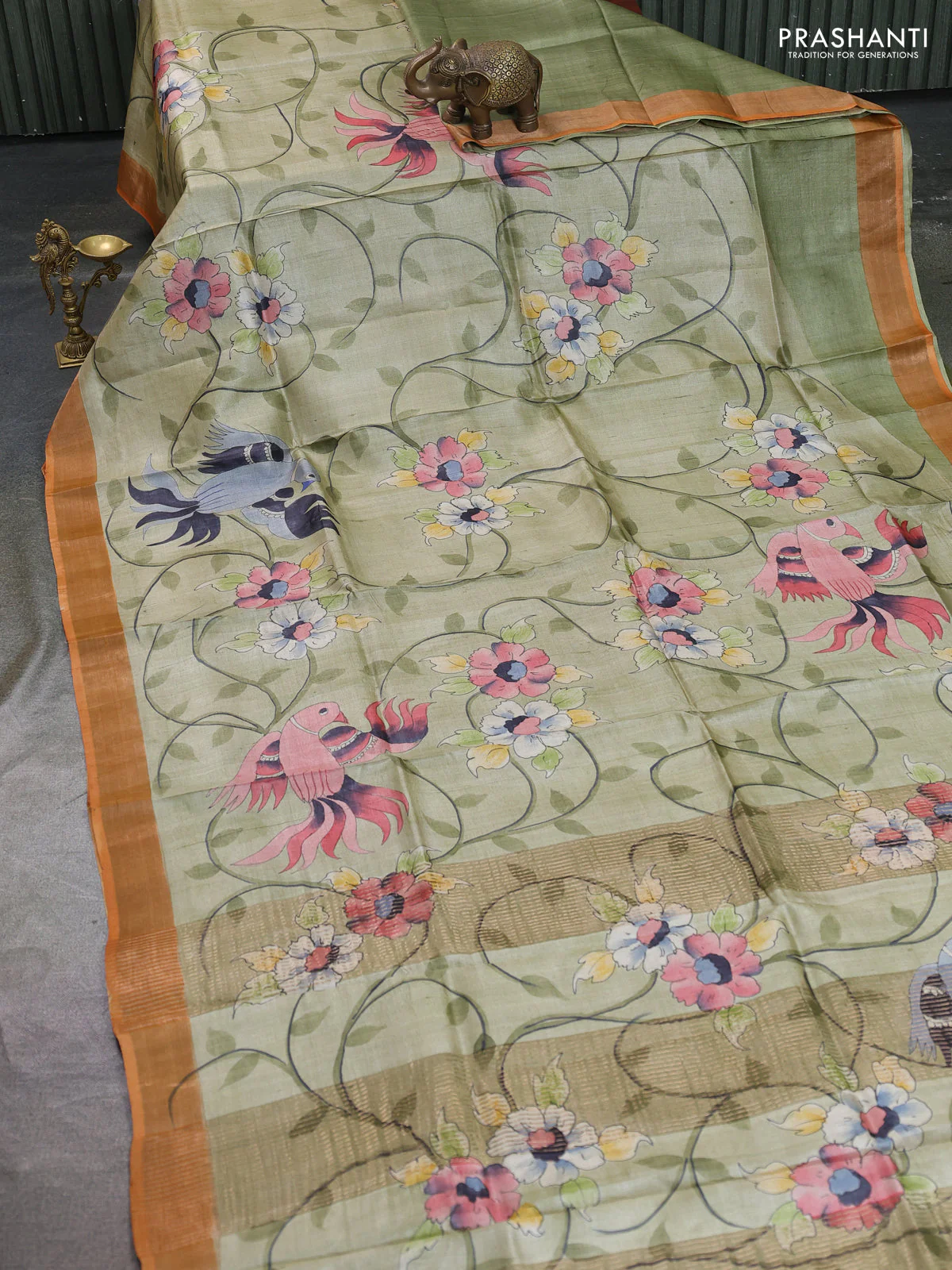 Pure tussar silk saree pastel green and orange with allover hand painted prints and zari woven border - Image 2