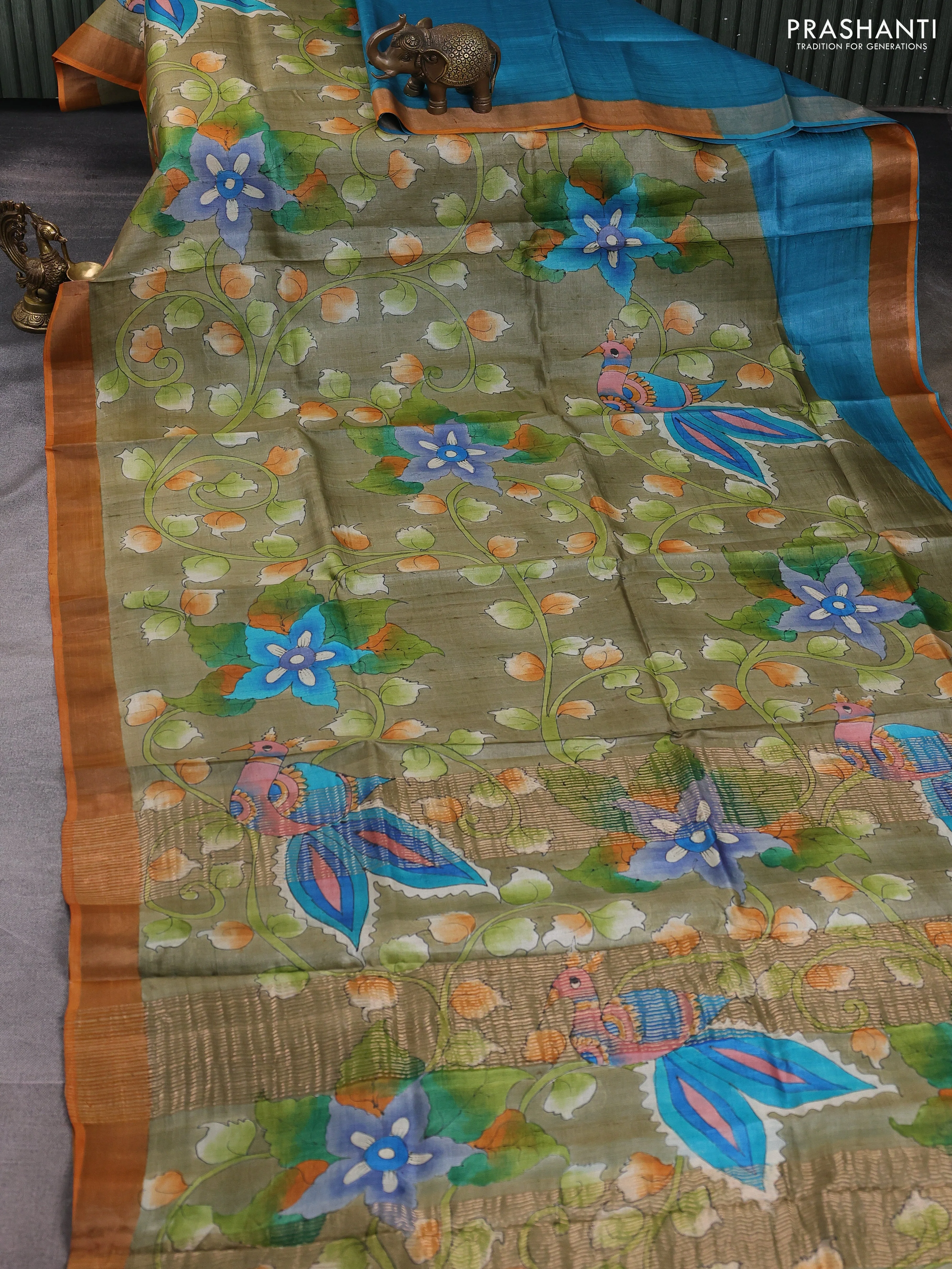 Pure tussar silk saree pastel green and orange with allover kalamkari hand painted prints and zari woven border - Image 2