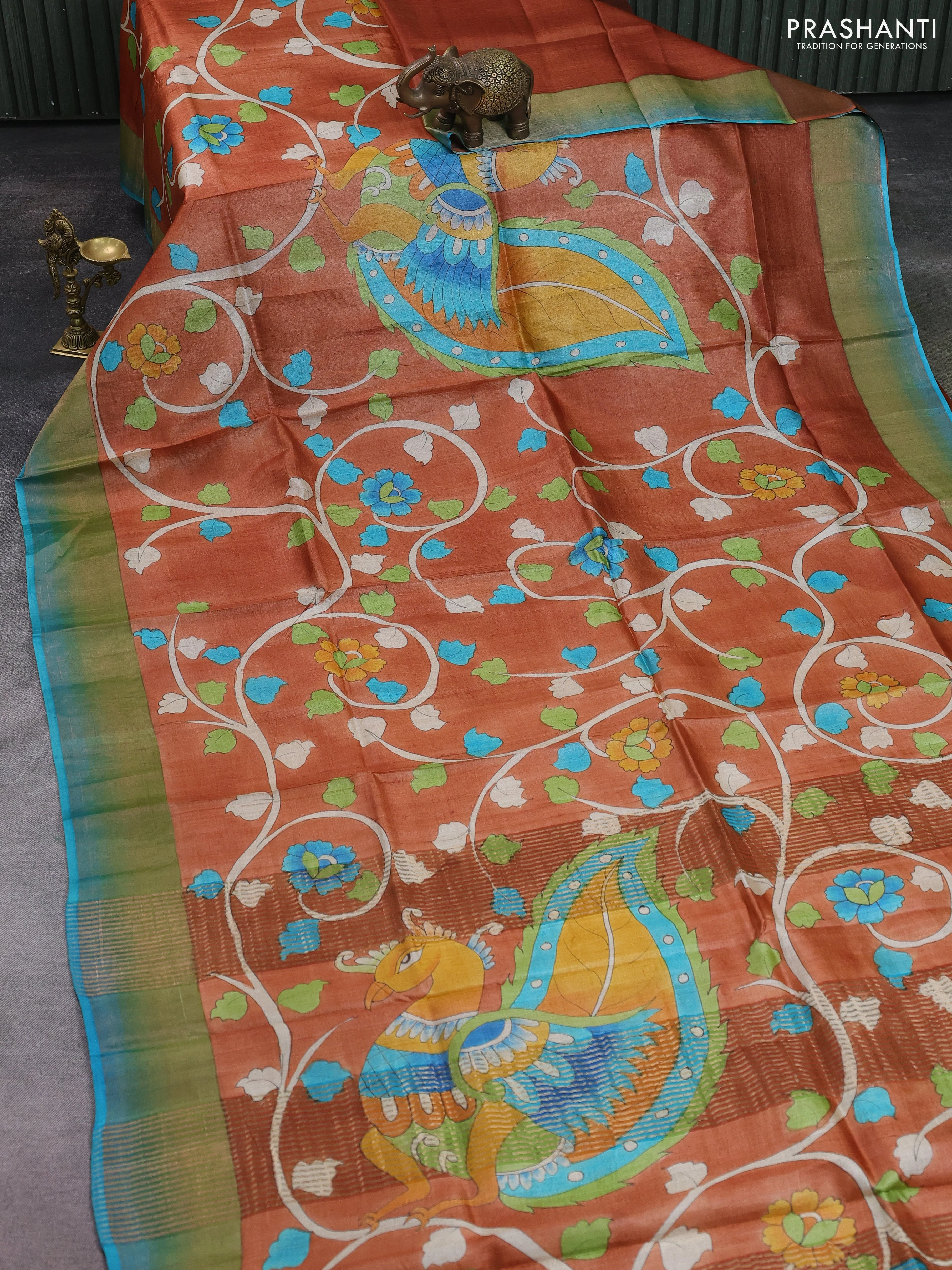 Pure tussar silk saree peach shade and cs blue with allover kalamkari hand painted prints and zari woven border - Image 2