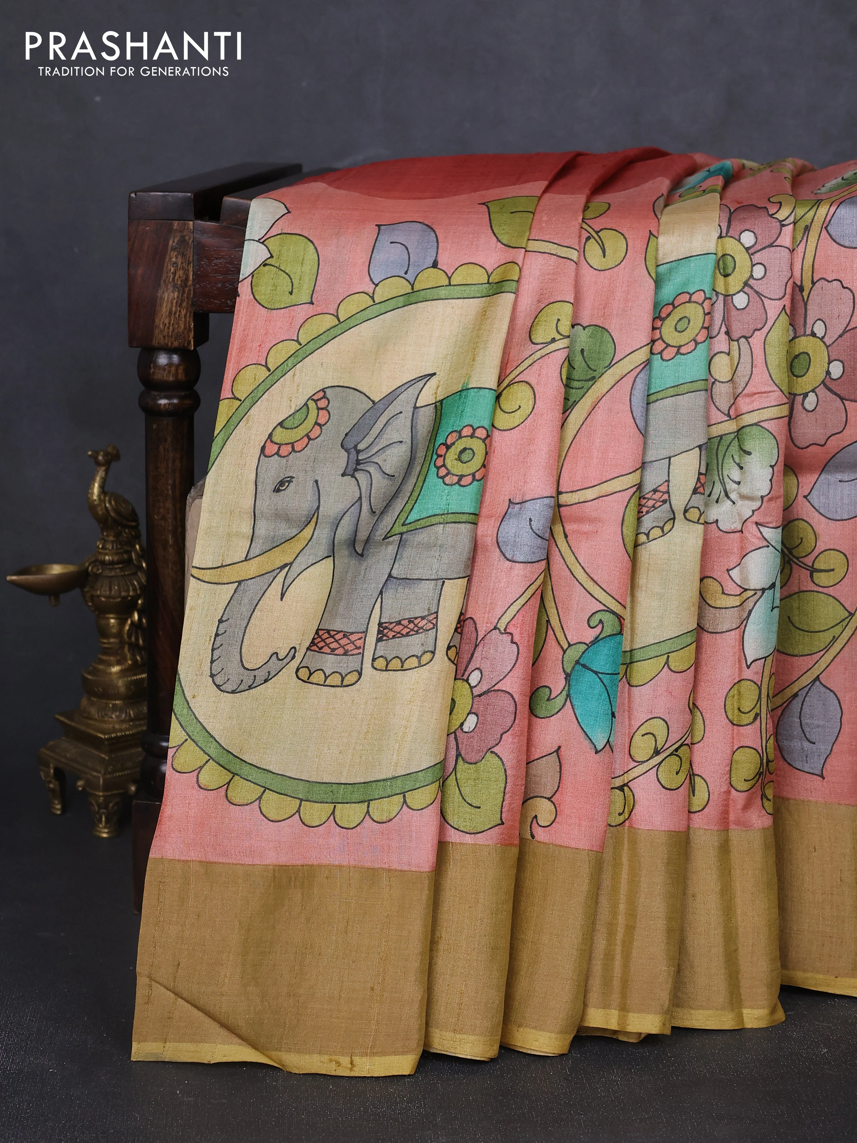 Pure tussar silk saree peach shade and sandal with allover kalamkari hand painted prints and zari woven border