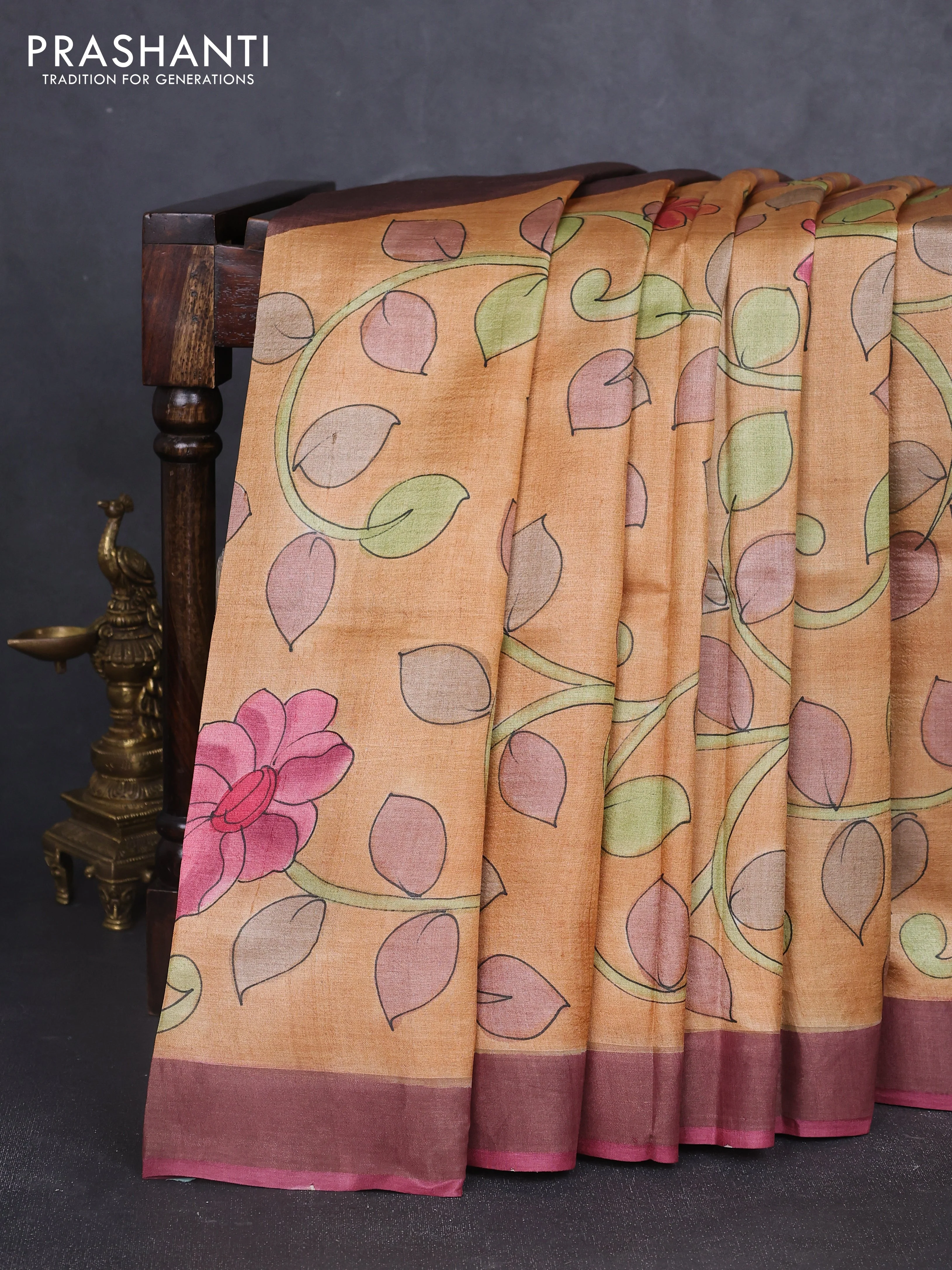 Pure tussar silk saree sandal and mauve pink with allover hand painted prints and zari woven border
